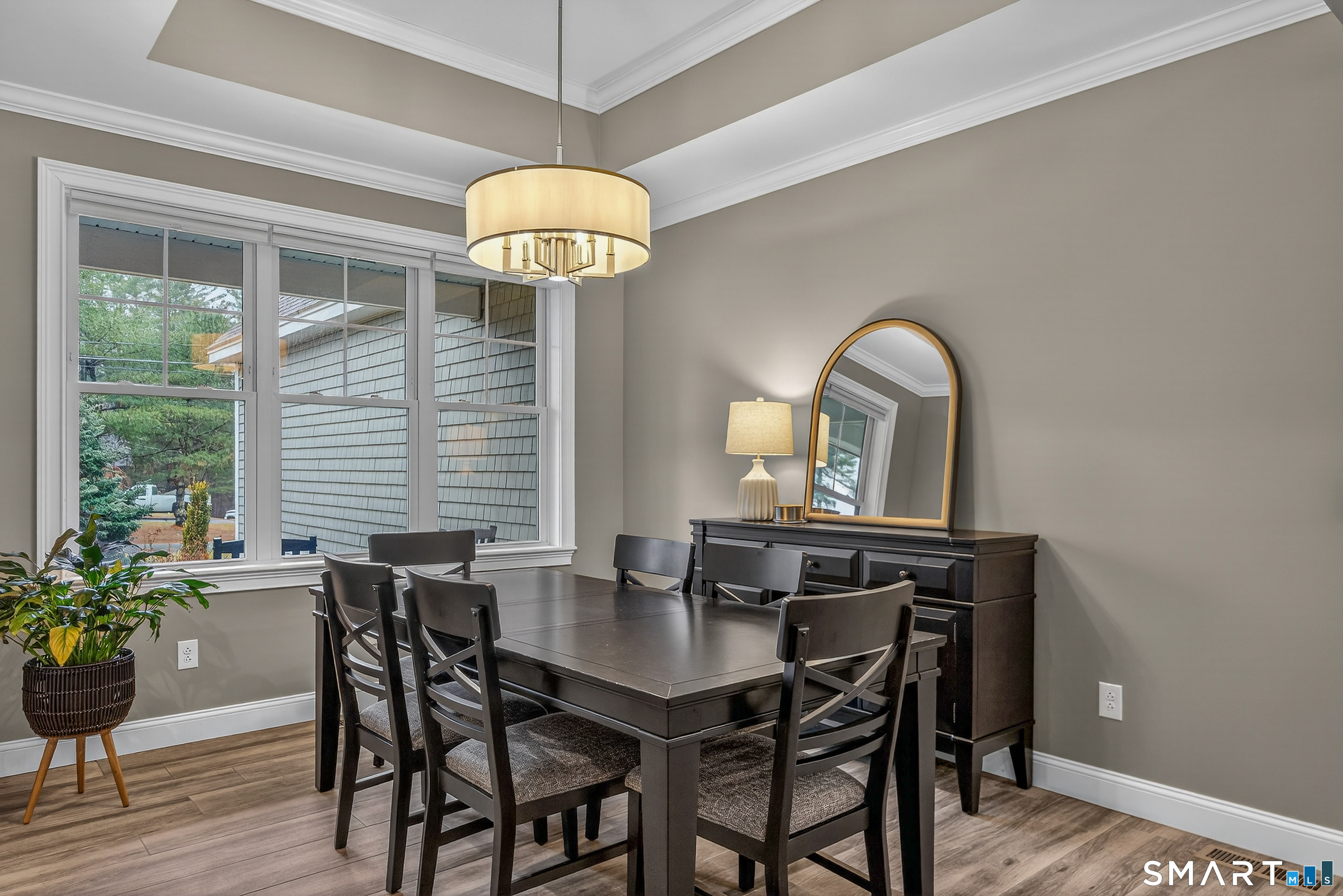 91 Hampden Road Stafford, CT 06076 - Photo 14 of 40 a view of a dining room with furniture window and wooden floor