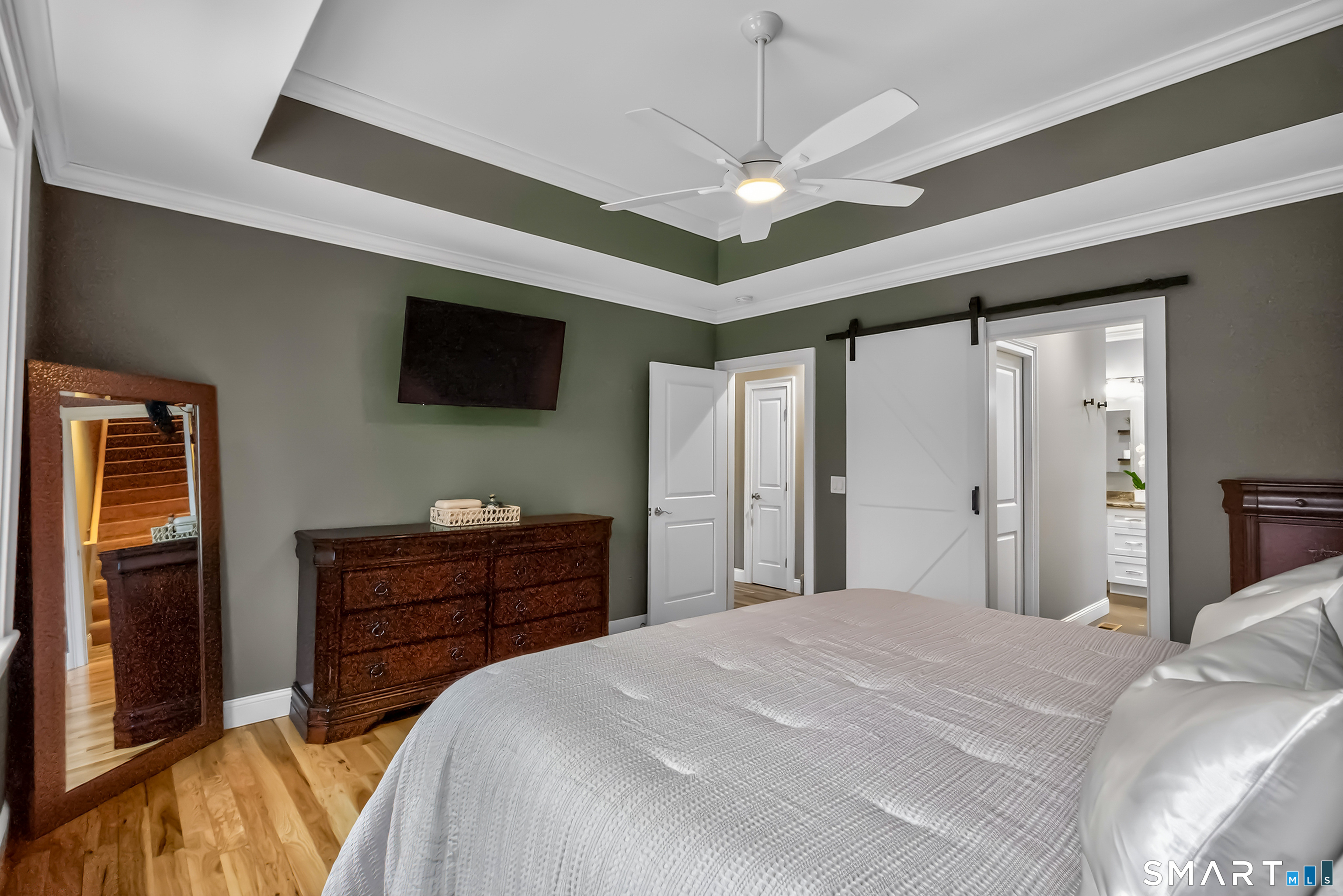 91 Hampden Road Stafford, CT 06076 - Photo 18 of 40 a bedroom with a bed and a flat screen tv