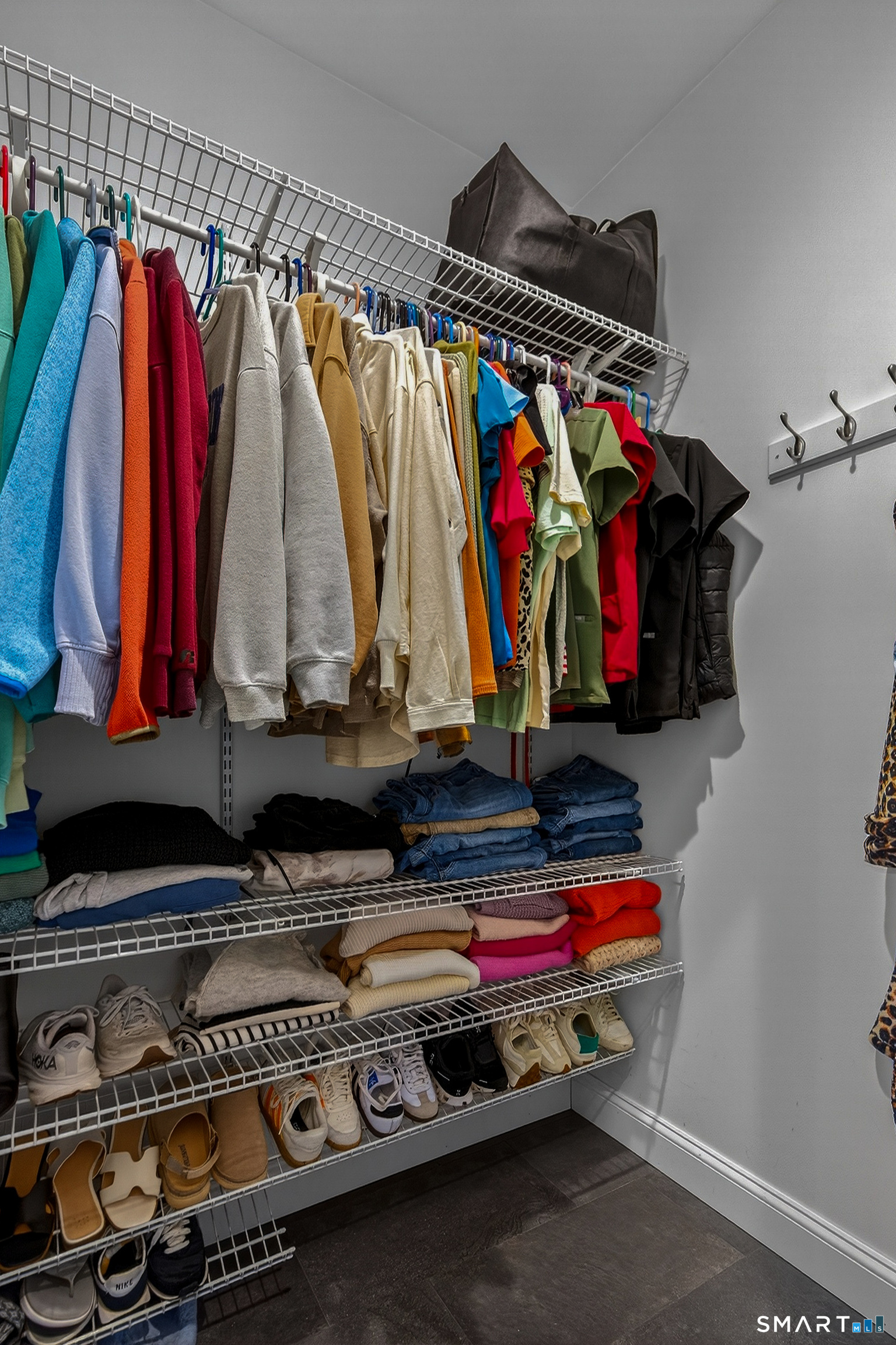 91 Hampden Road Stafford, CT 06076 - Photo 21 of 40 a view of walk in closet with clothes and shoes