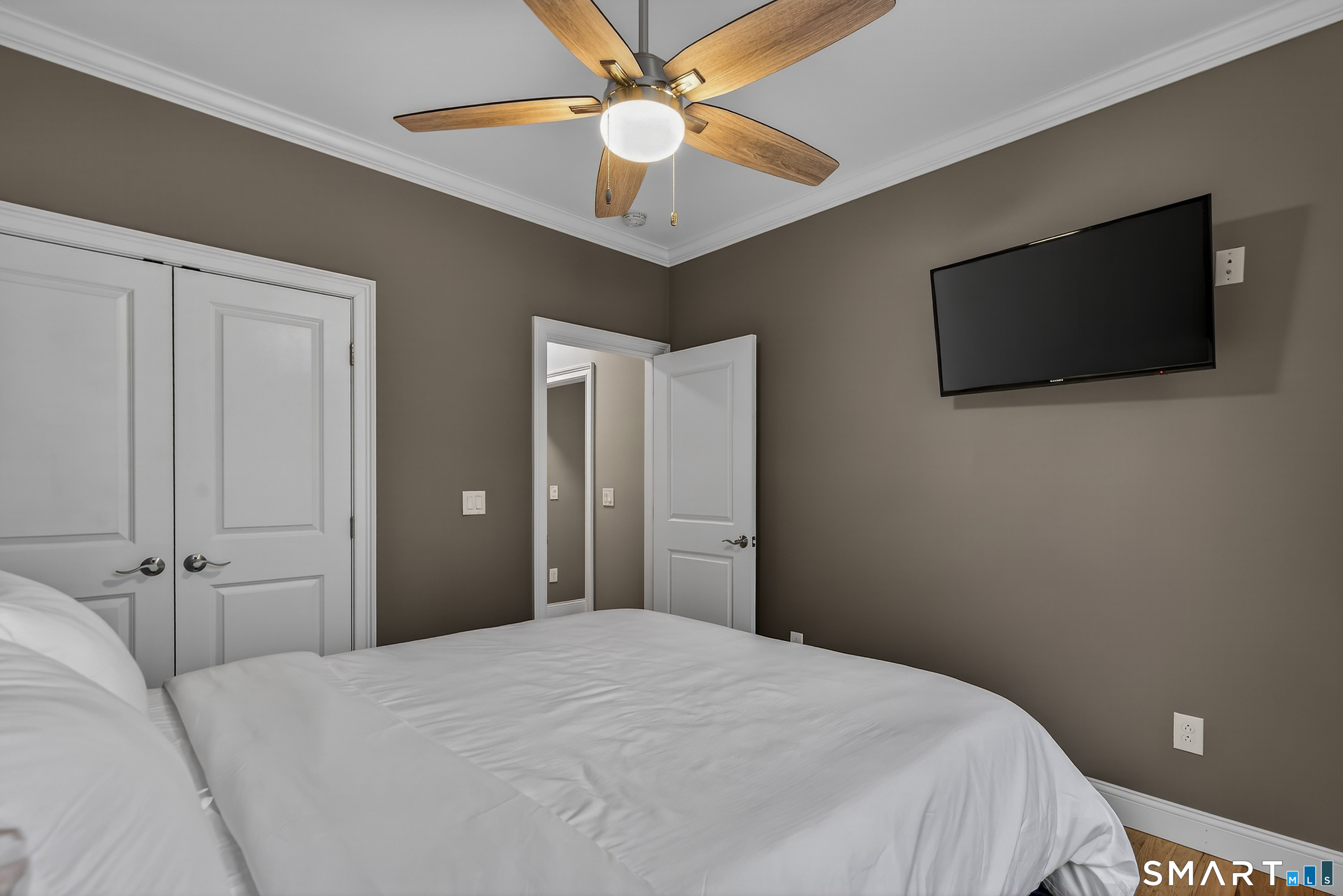 91 Hampden Road Stafford, CT 06076 - Photo 22 of 40 a bedroom with a bed and a flat screen tv