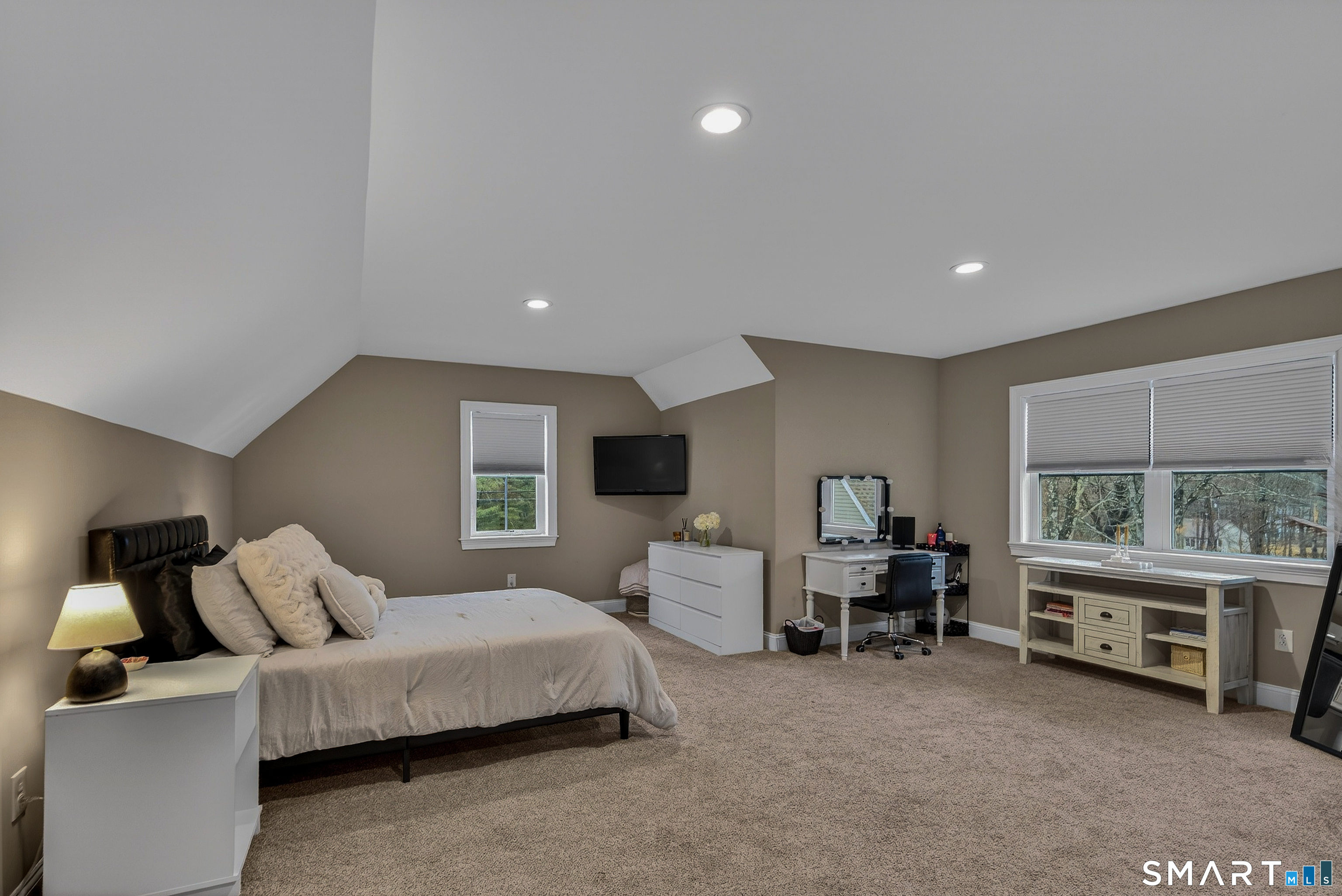 91 Hampden Road Stafford, CT 06076 - Photo 25 of 40 a spacious bedroom with a bed and a large window