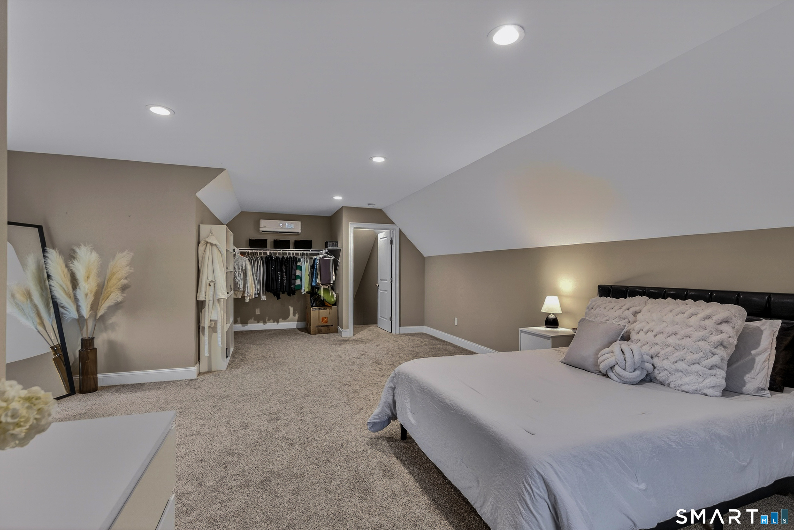 91 Hampden Road Stafford, CT 06076 - Photo 26 of 40 a spacious bedroom with a bed and a couch