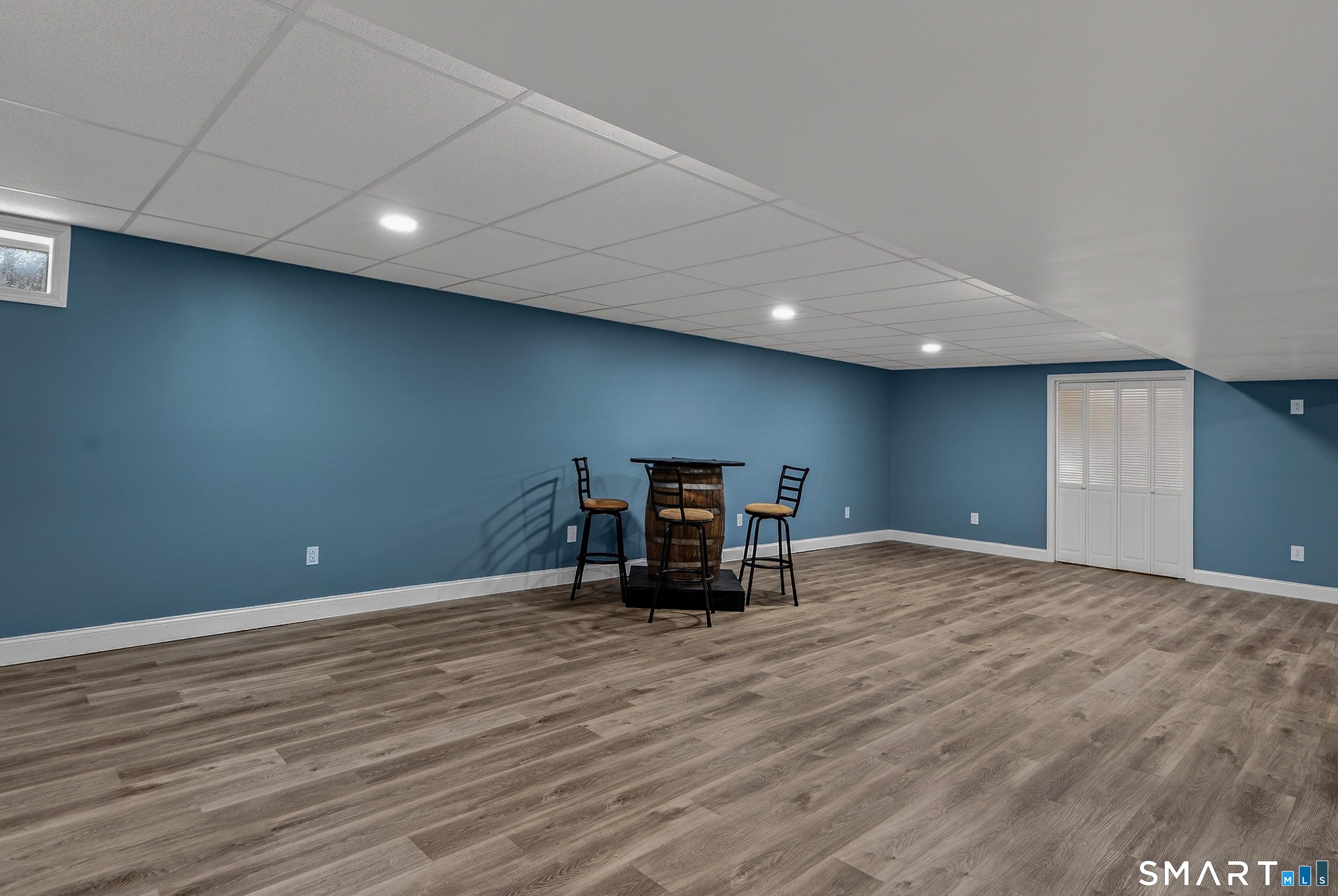 91 Hampden Road Stafford, CT 06076 - Photo 27 of 40 a view of an empty room with wooden floor