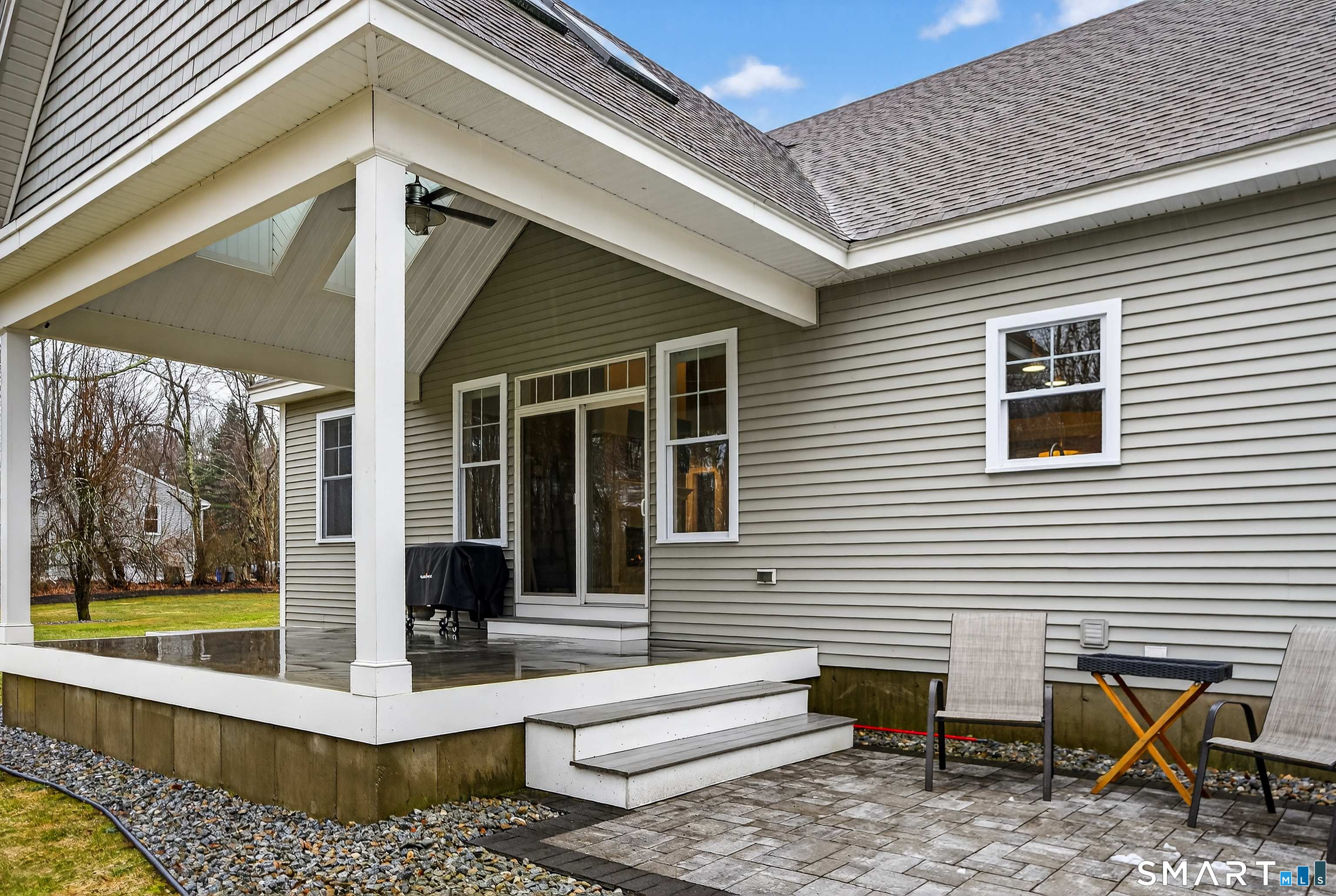 91 Hampden Road Stafford, CT 06076 - Photo 36 of 40 a view of a patio with table and chairs and wooden floor