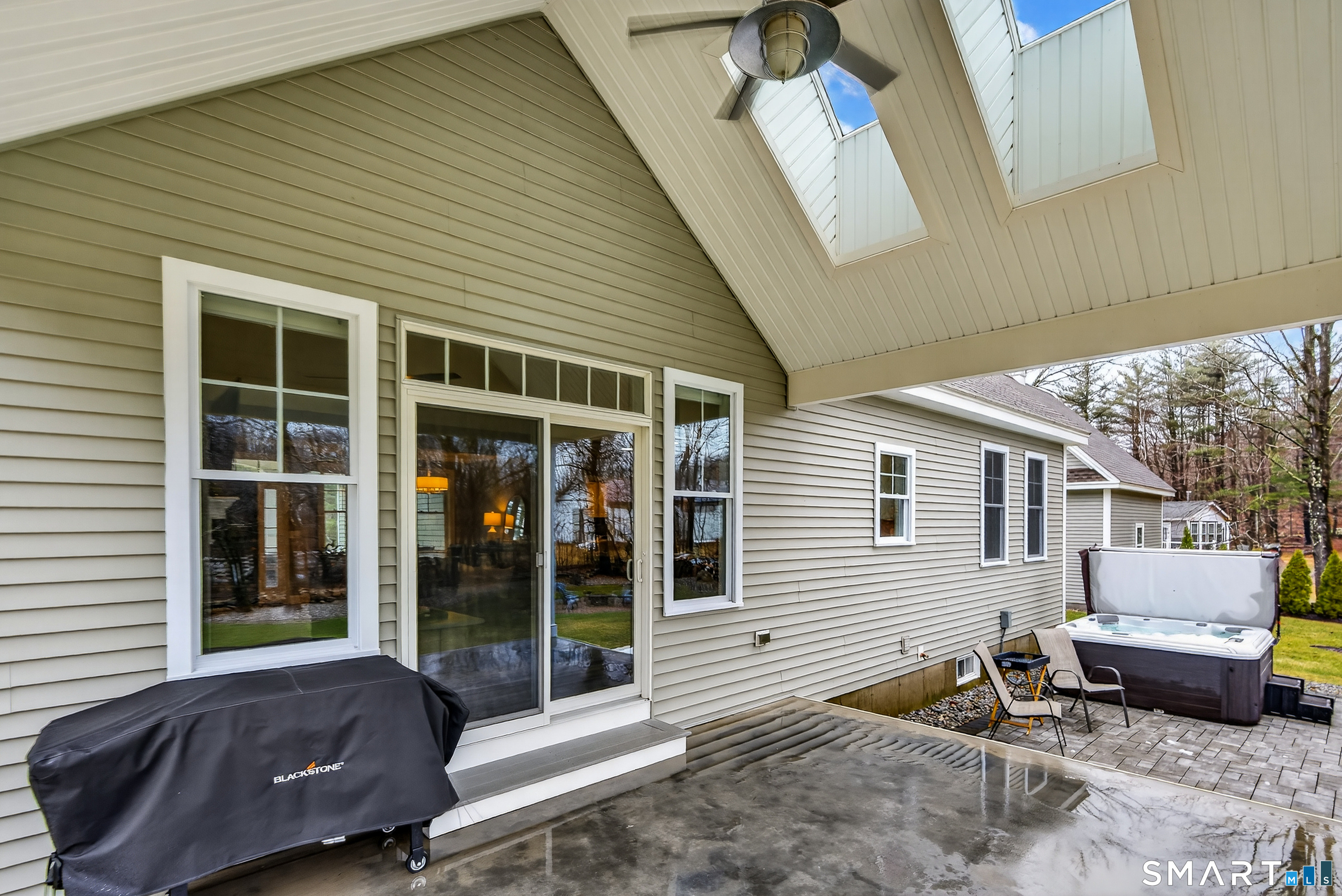 91 Hampden Road Stafford, CT 06076 - Photo 37 of 40 a view of a house with a patio and a yard