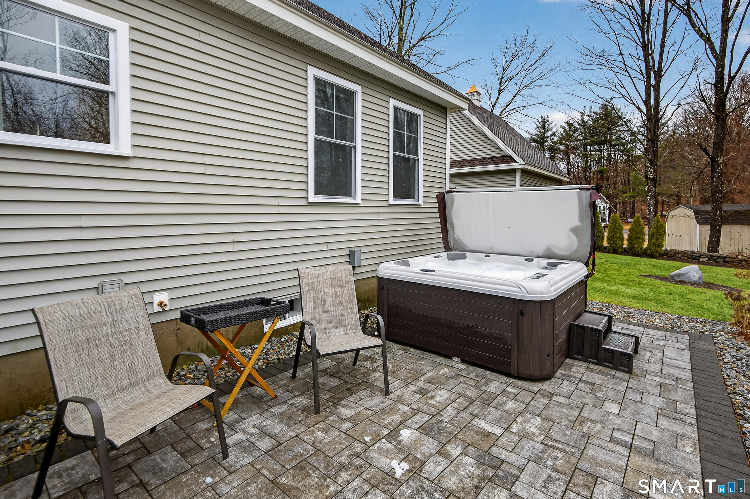 91 Hampden Road Stafford, CT 06076 - Photo 39 of 40 a backyard of a house with table and chairs
