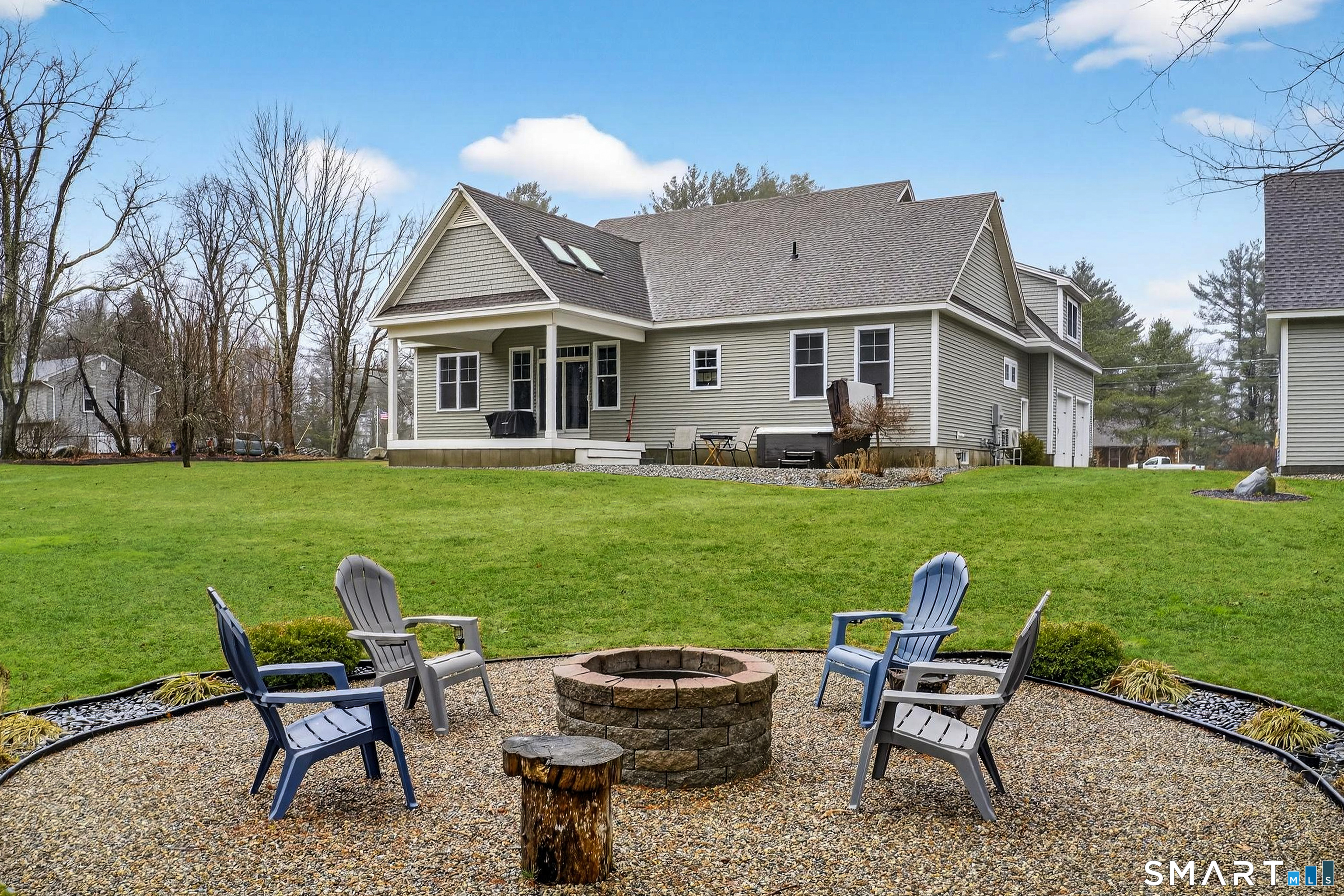 91 Hampden Road Stafford, CT 06076 - Photo 40 of 40 a view of a house with a yard and sitting area