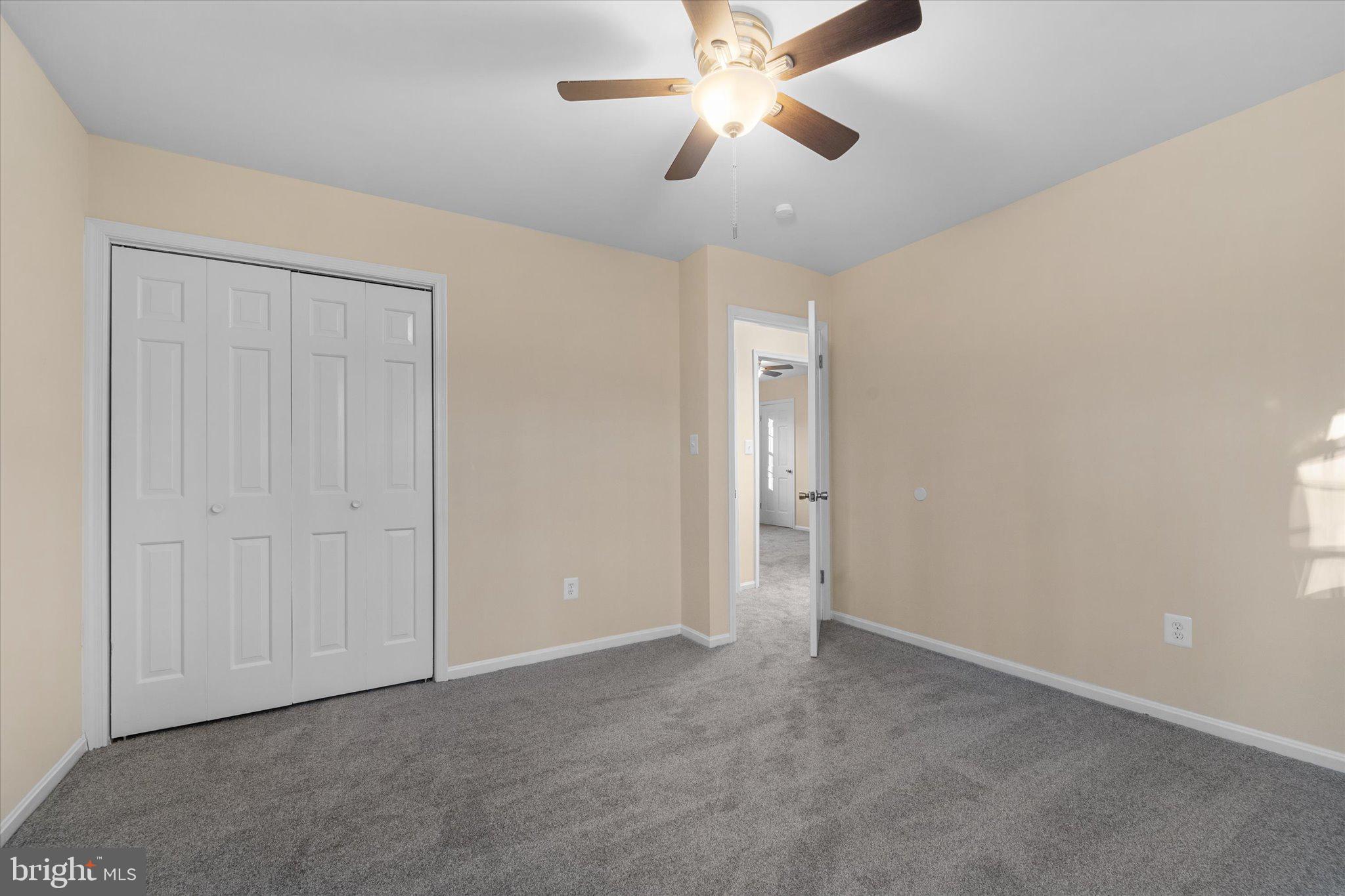 8016 Stillbrooke Road Manassas, VA 20112 - Photo 31 of 41 a view of an empty room and chandelier fan