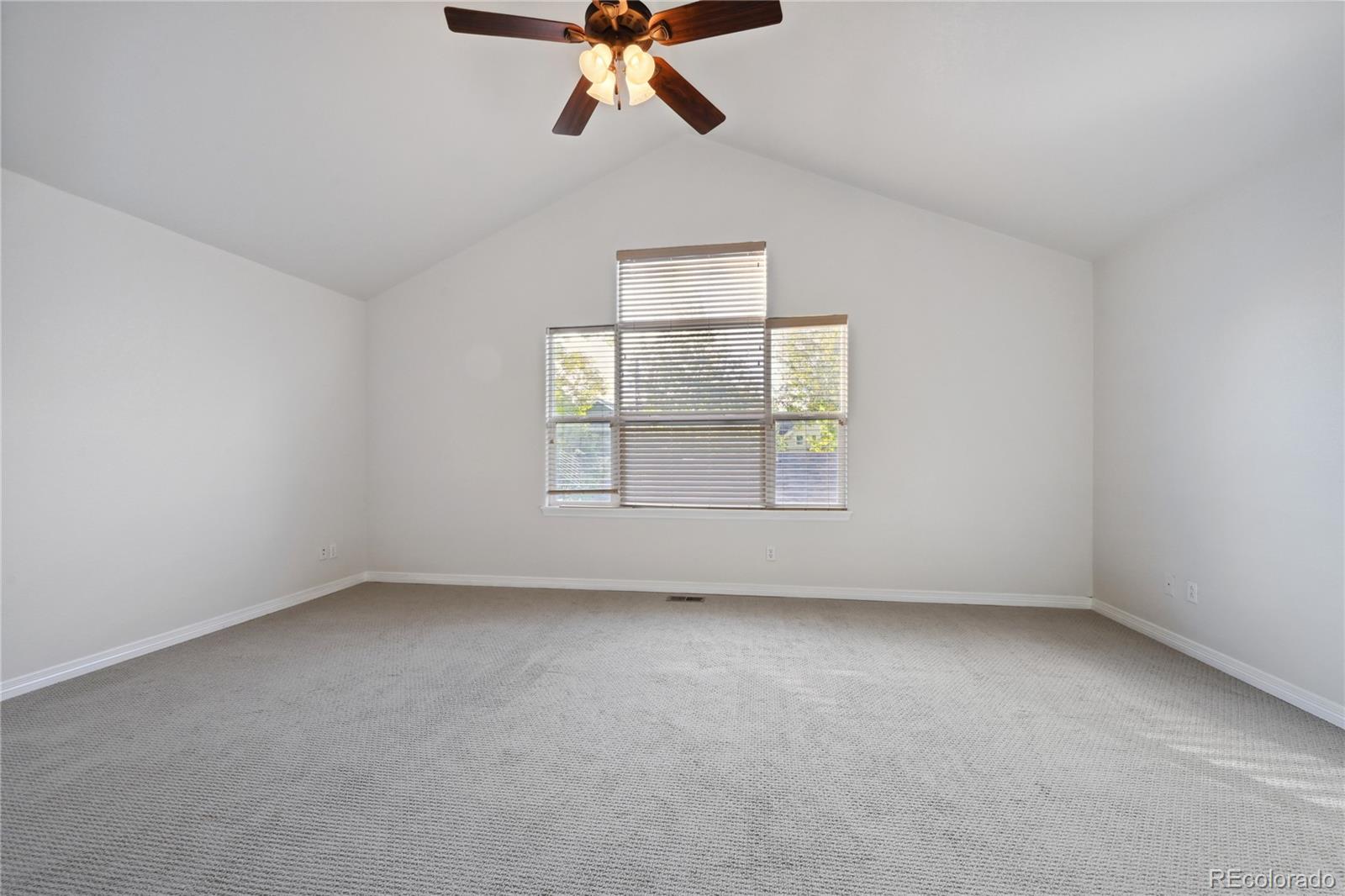 3515 Perry Street Denver, CO 80212 - Photo 14 of 40 an empty room with a window and a fan