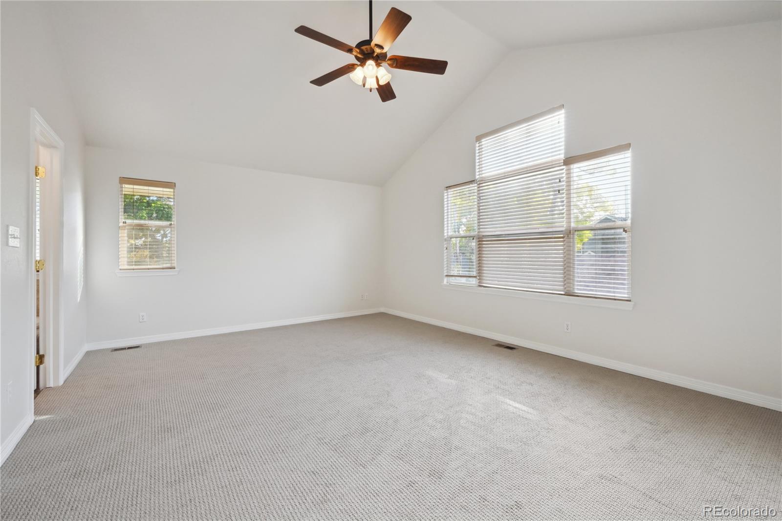 3515 Perry Street Denver, CO 80212 - Photo 15 of 40 an empty room with windows and fan