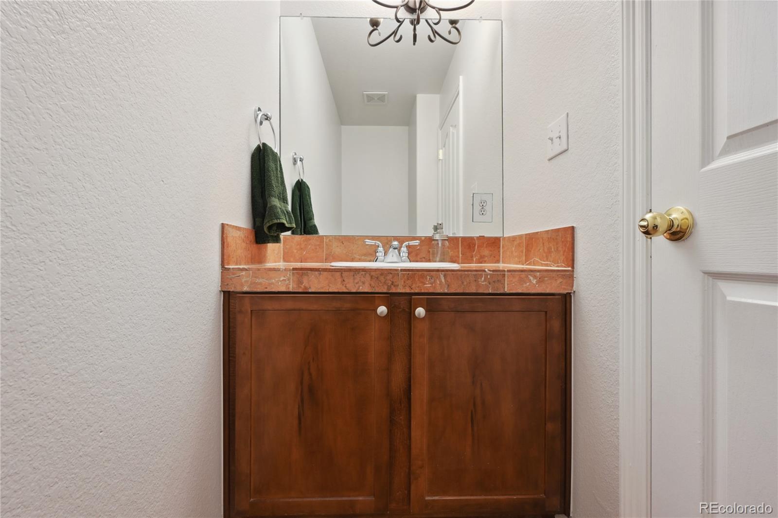 3515 Perry Street Denver, CO 80212 - Photo 28 of 40 a bathroom with a sink and a mirror