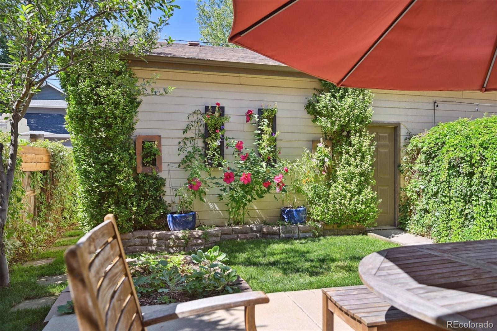 3515 Perry Street Denver, CO 80212 - Photo 30 of 40 a view of a chair and table in the backyard