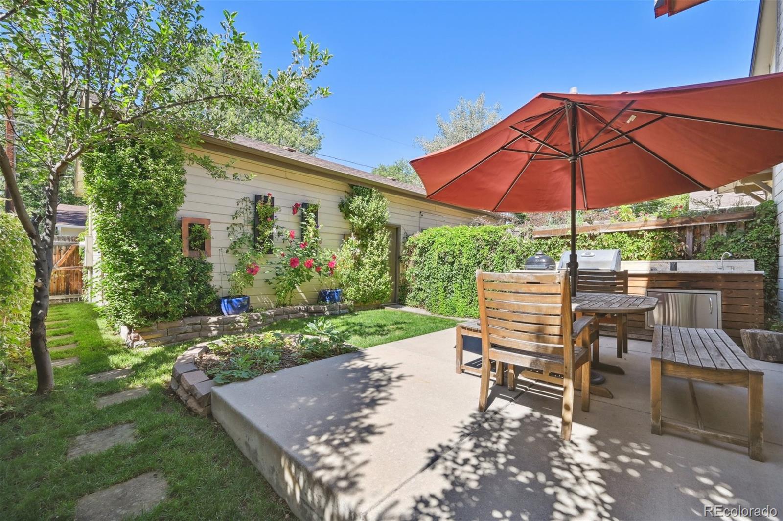 3515 Perry Street Denver, CO 80212 - Photo 3 of 40 a view of a backyard with sitting area and furniture