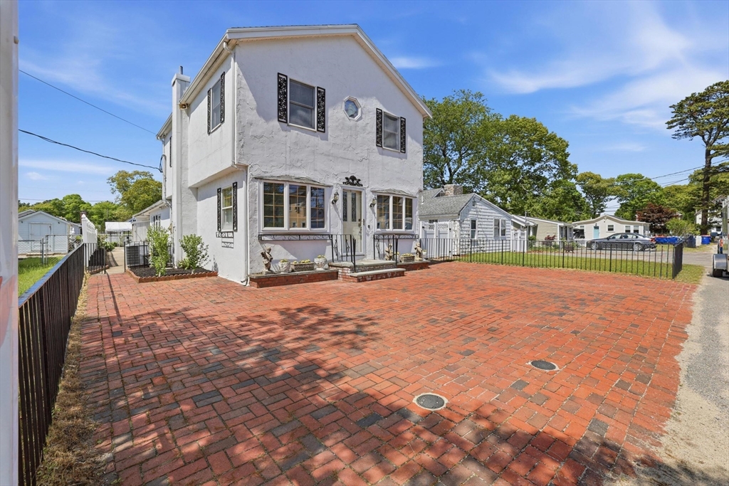 7 Swift Avenue Wareham, MA 02571 - Photo 2 of 42 a front view of a house with a yard