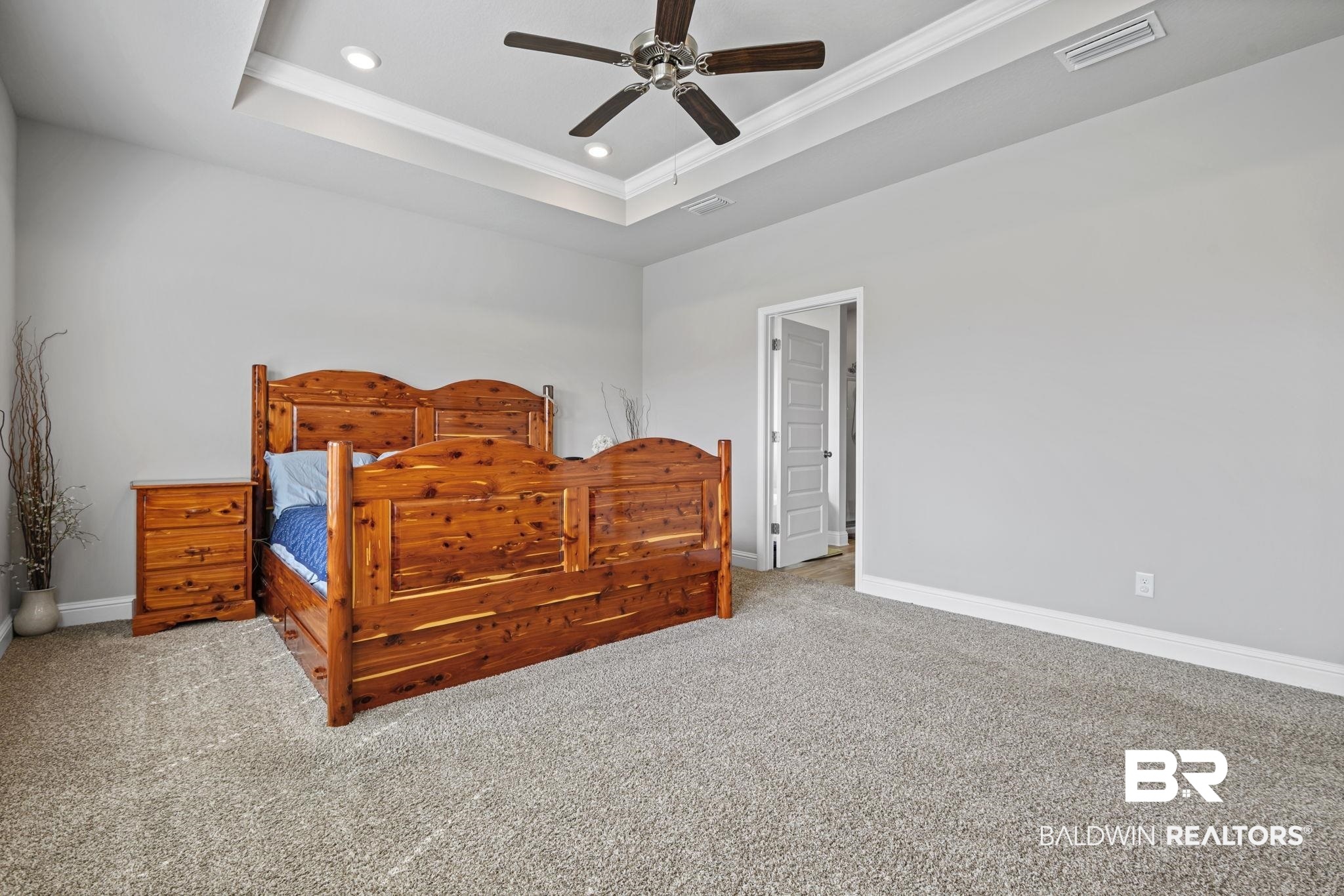 2183 Meadowview Loop Semmes, AL 36575 - Photo 42 of 58 Carpeted bedroom featuring a ceiling fan, recessed lighting, a tray ceiling, and ornamental molding
