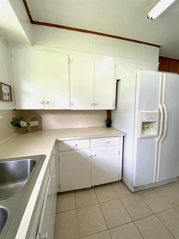 810 Poleman Road Shreveport, LA 71107 - Photo 13 of 25 a utility room with cabinets washer and dryer