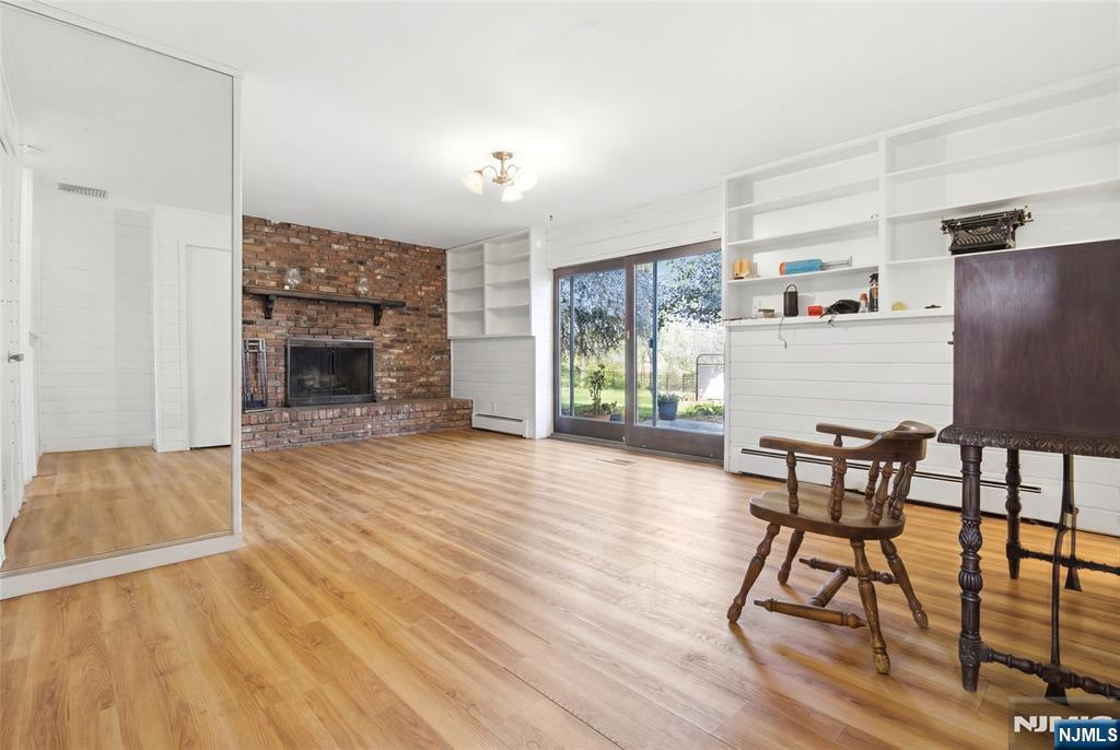 120 Carlough Road Upper Saddle River, NJ 07458 - Photo 18 of 25 a living room with furniture and a fireplace