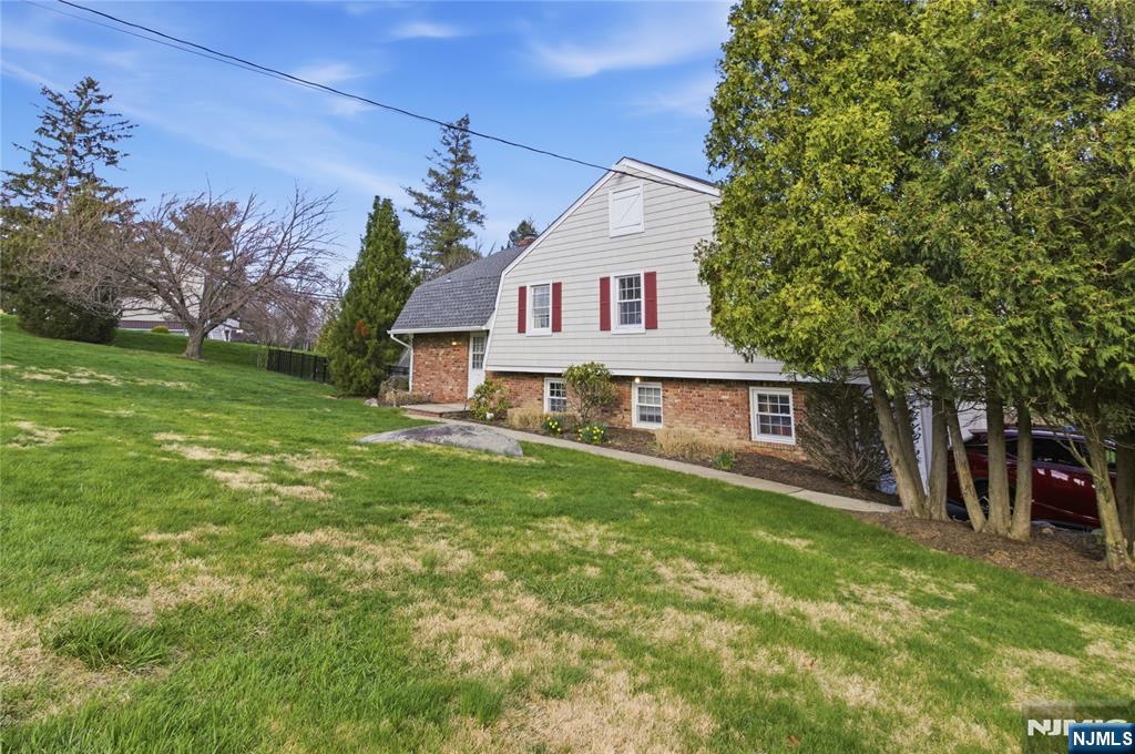 120 Carlough Road Upper Saddle River, NJ 07458 - Photo 2 of 25 a view of a yard in front of house