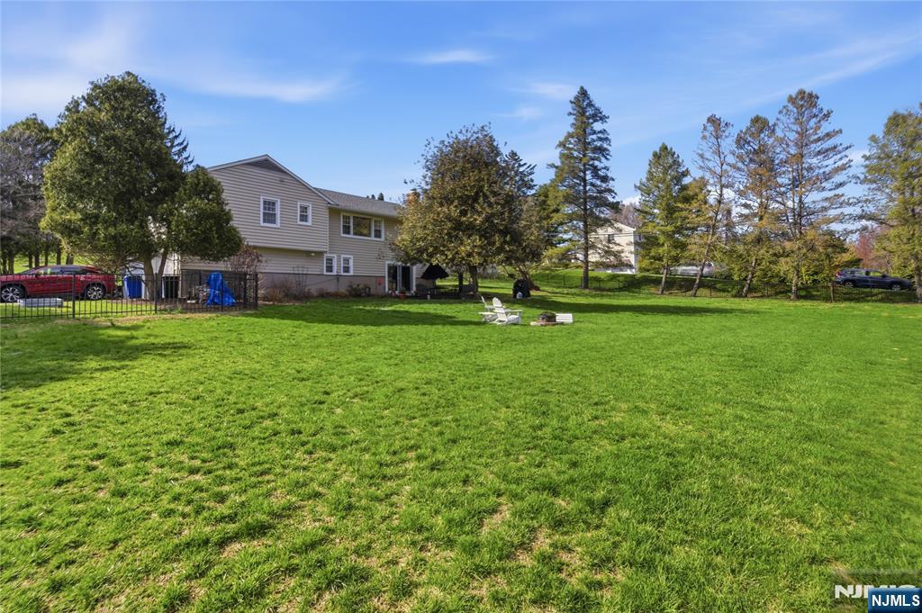 120 Carlough Road Upper Saddle River, NJ 07458 - Photo 24 of 25 a front view of a house with garden