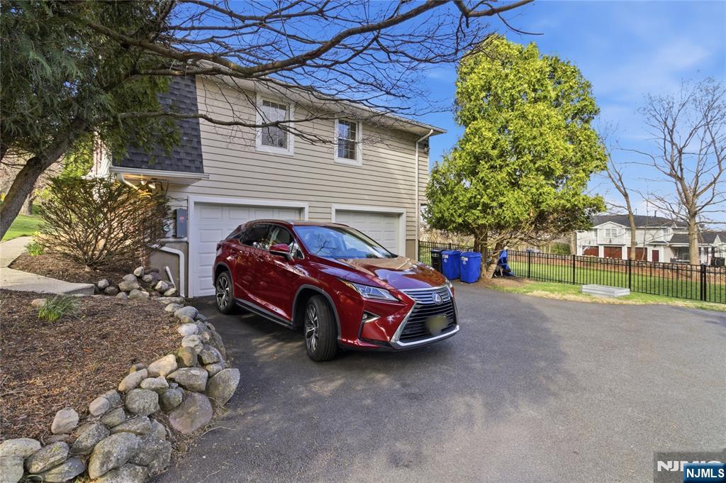 120 Carlough Road Upper Saddle River, NJ 07458 - Photo 25 of 25 a car parked in front of a house