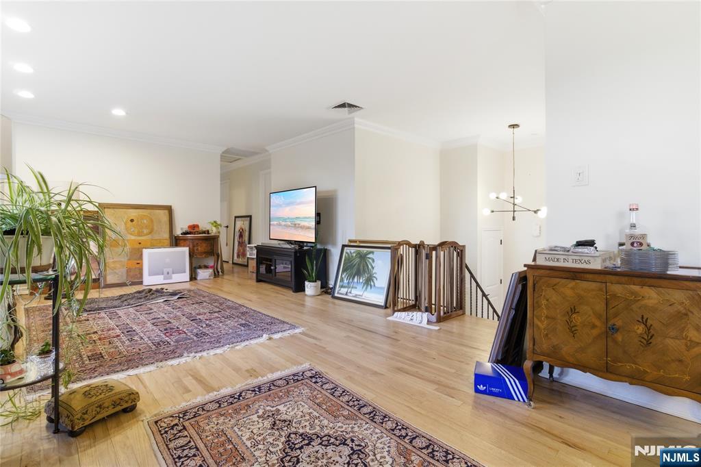 120 Carlough Road Upper Saddle River, NJ 07458 - Photo 5 of 25 a living room with furniture and a flat screen tv