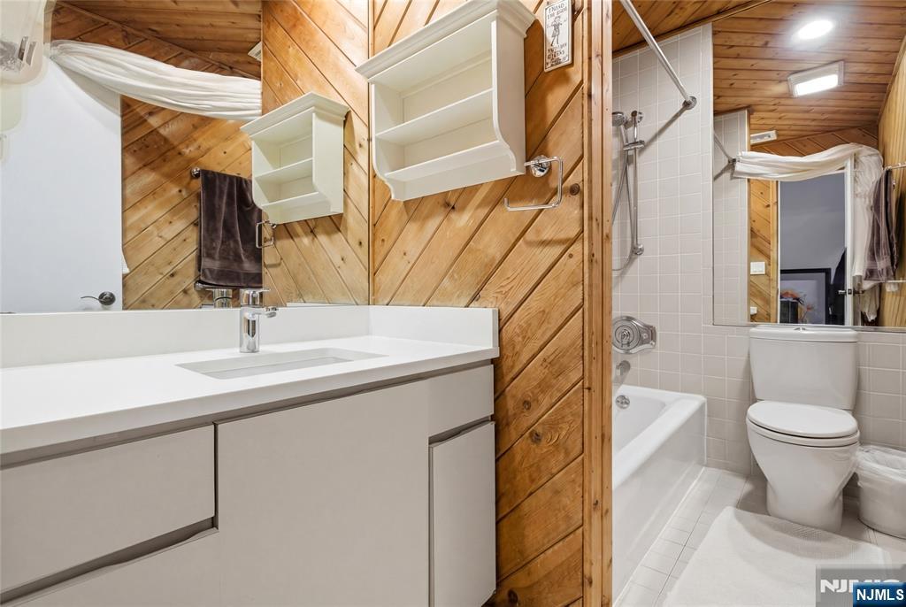 120 Carlough Road Upper Saddle River, NJ 07458 - Photo 6 of 25 a bathroom with a sink a toilet and shower