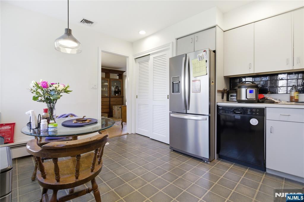 120 Carlough Road Upper Saddle River, NJ 07458 - Photo 8 of 25 a kitchen with stainless steel appliances granite countertop a refrigerator and a sink