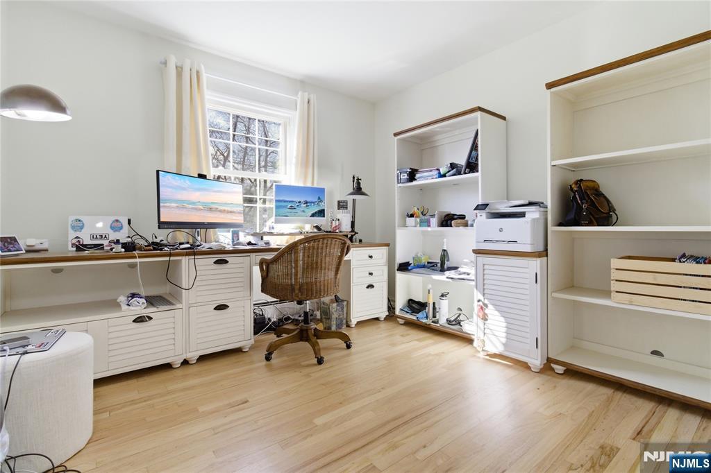 120 Carlough Road Upper Saddle River, NJ 07458 - Photo 10 of 25 a room with furniture and a window