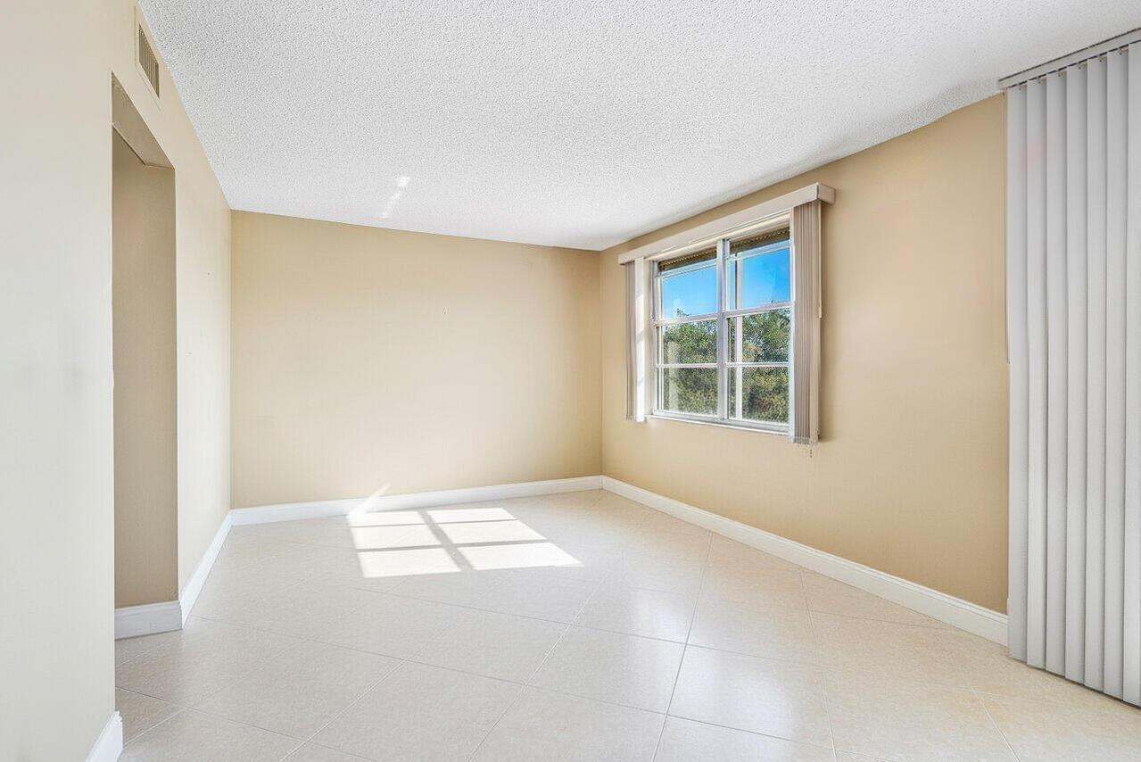 6200 Northwest 2nd Avenue, Unit 415 Boca Raton, FL 33487 - Photo 11 of 31 a view of an empty room with windows