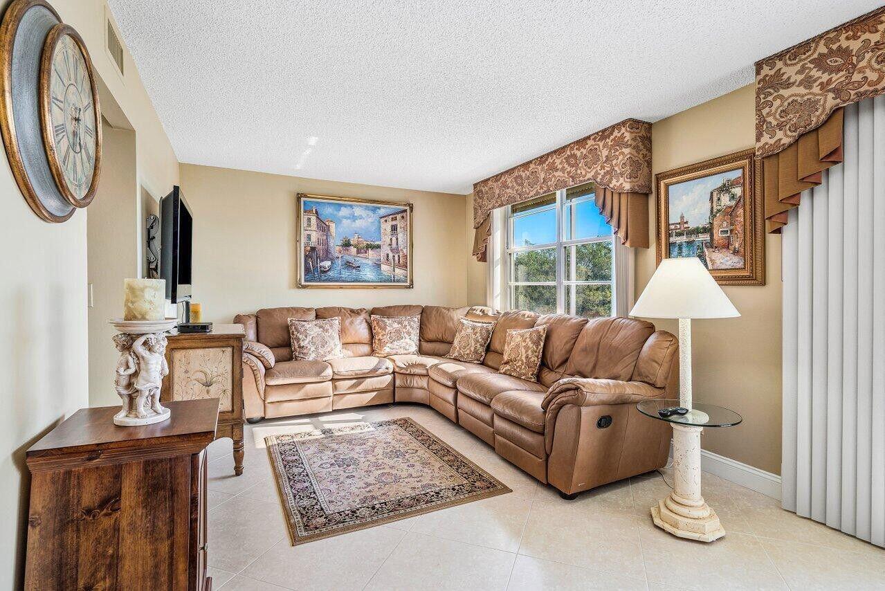 6200 Northwest 2nd Avenue, Unit 415 Boca Raton, FL 33487 - Photo 12 of 31 a living room with furniture and a large window