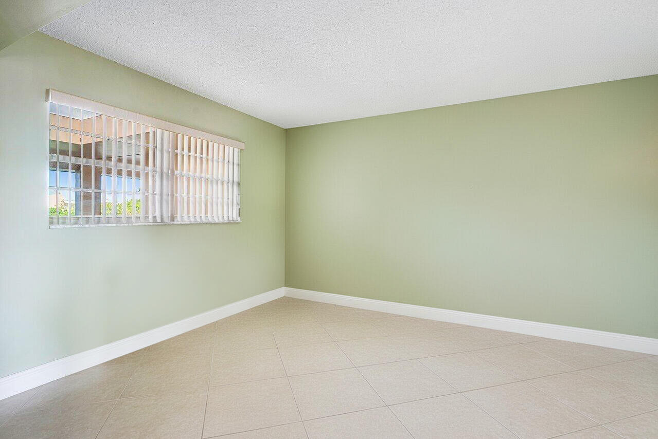 6200 Northwest 2nd Avenue, Unit 415 Boca Raton, FL 33487 - Photo 23 of 31 an empty room with a empty space and a window