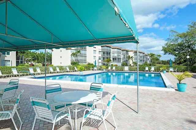 a view of a swimming pool with a patio