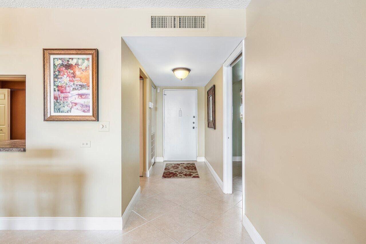 6200 Northwest 2nd Avenue, Unit 415 Boca Raton, FL 33487 - Photo 4 of 31 a view of a hallway with front door