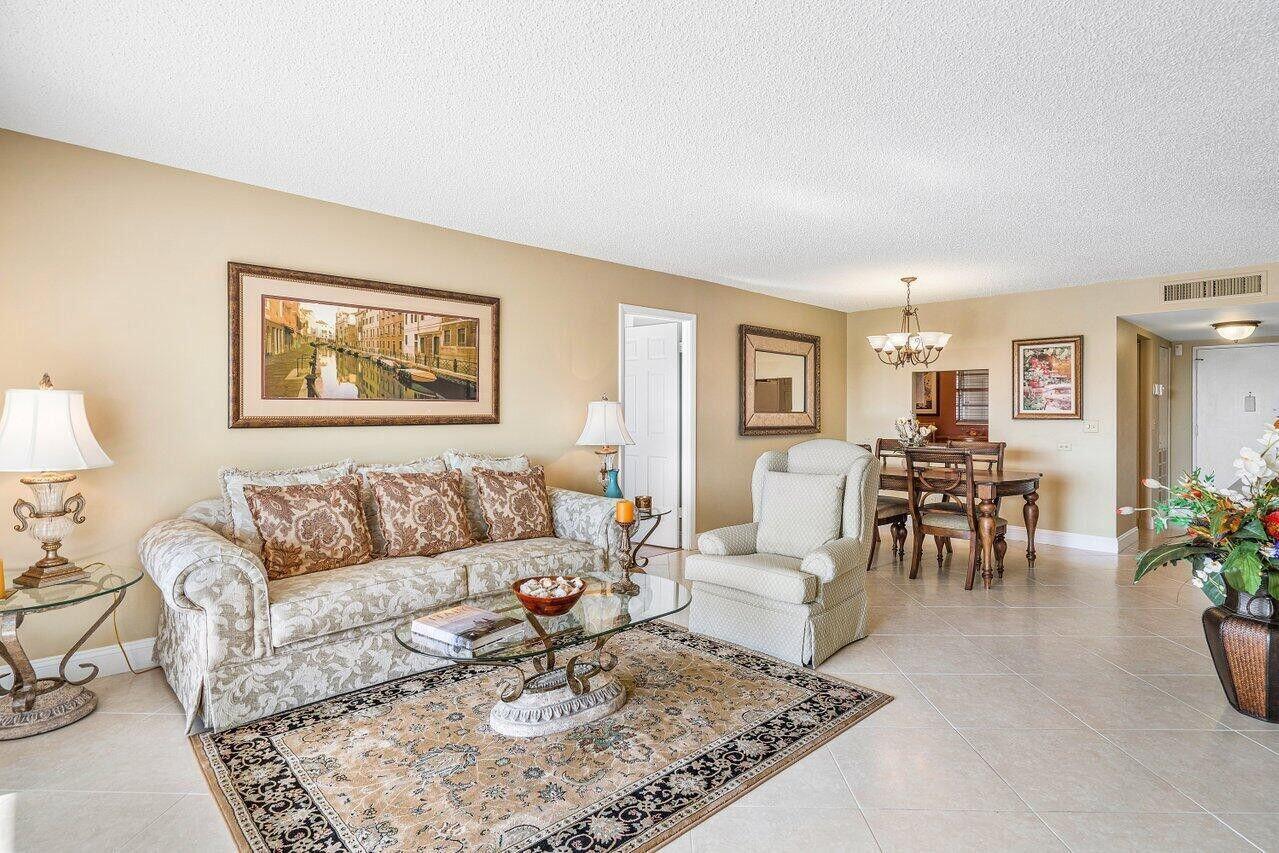 6200 Northwest 2nd Avenue, Unit 415 Boca Raton, FL 33487 - Photo 8 of 31 a living room with furniture and a table