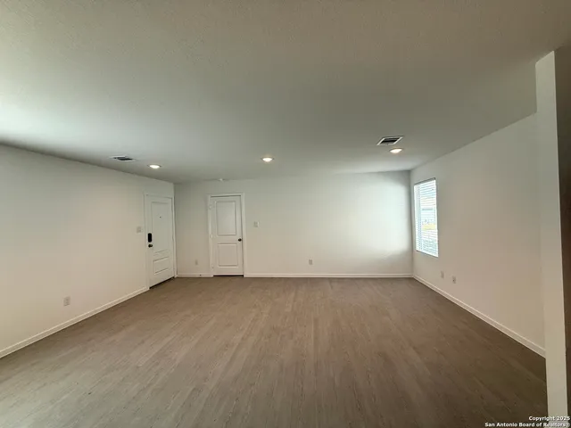 an empty room with a empty space and window