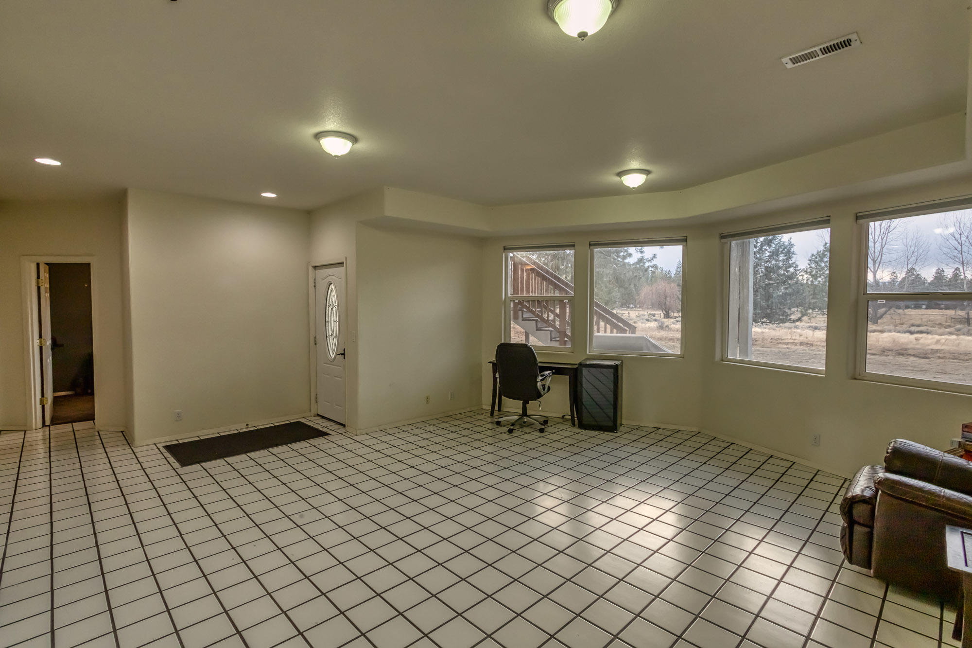 19490 Calico Road Bend, OR 97702 - Photo 33 of 67 a view of a big room with windows