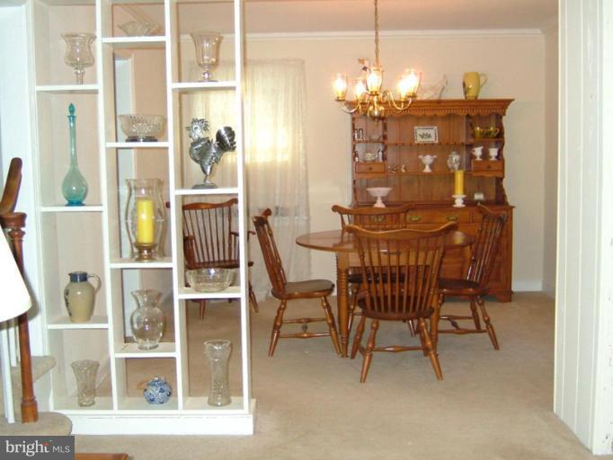 2805 Lindell Street Silver Spring, MD 20902 - Photo 8 of 9 a dining room with furniture and chandelier