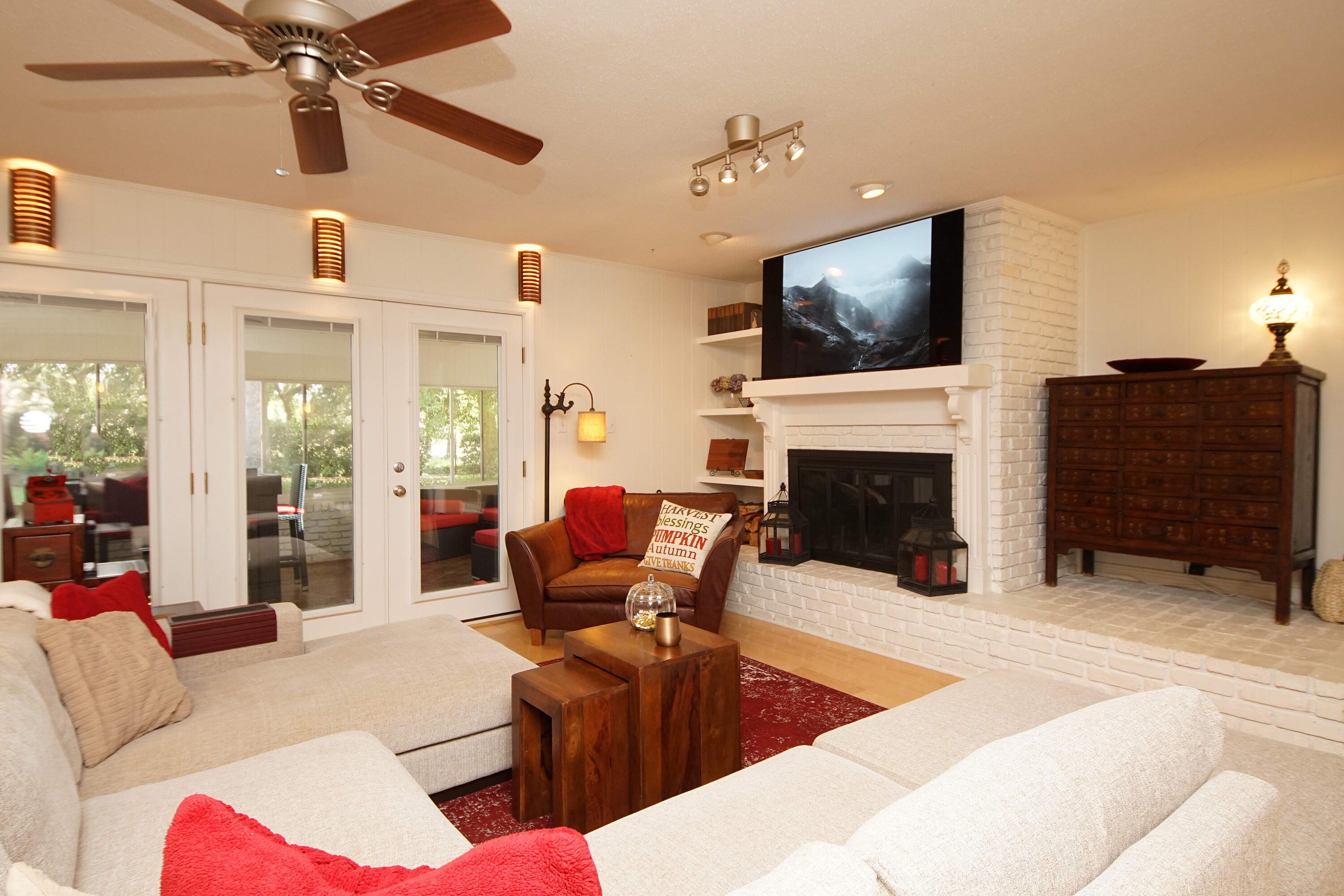 216 Country Club Road Shalimar, FL 32579 - Photo 11 of 59 a living room with furniture a flat screen tv and a fireplace