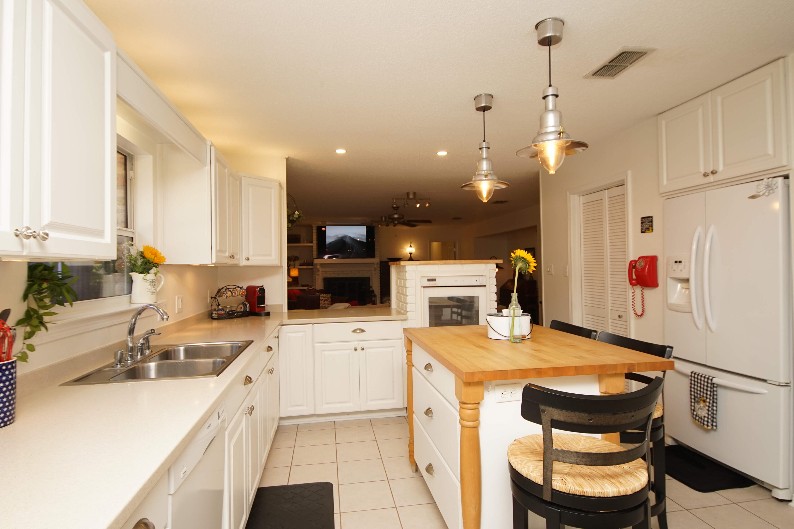 216 Country Club Road Shalimar, FL 32579 - Photo 16 of 59 a kitchen with a stove a refrigerator and a sink