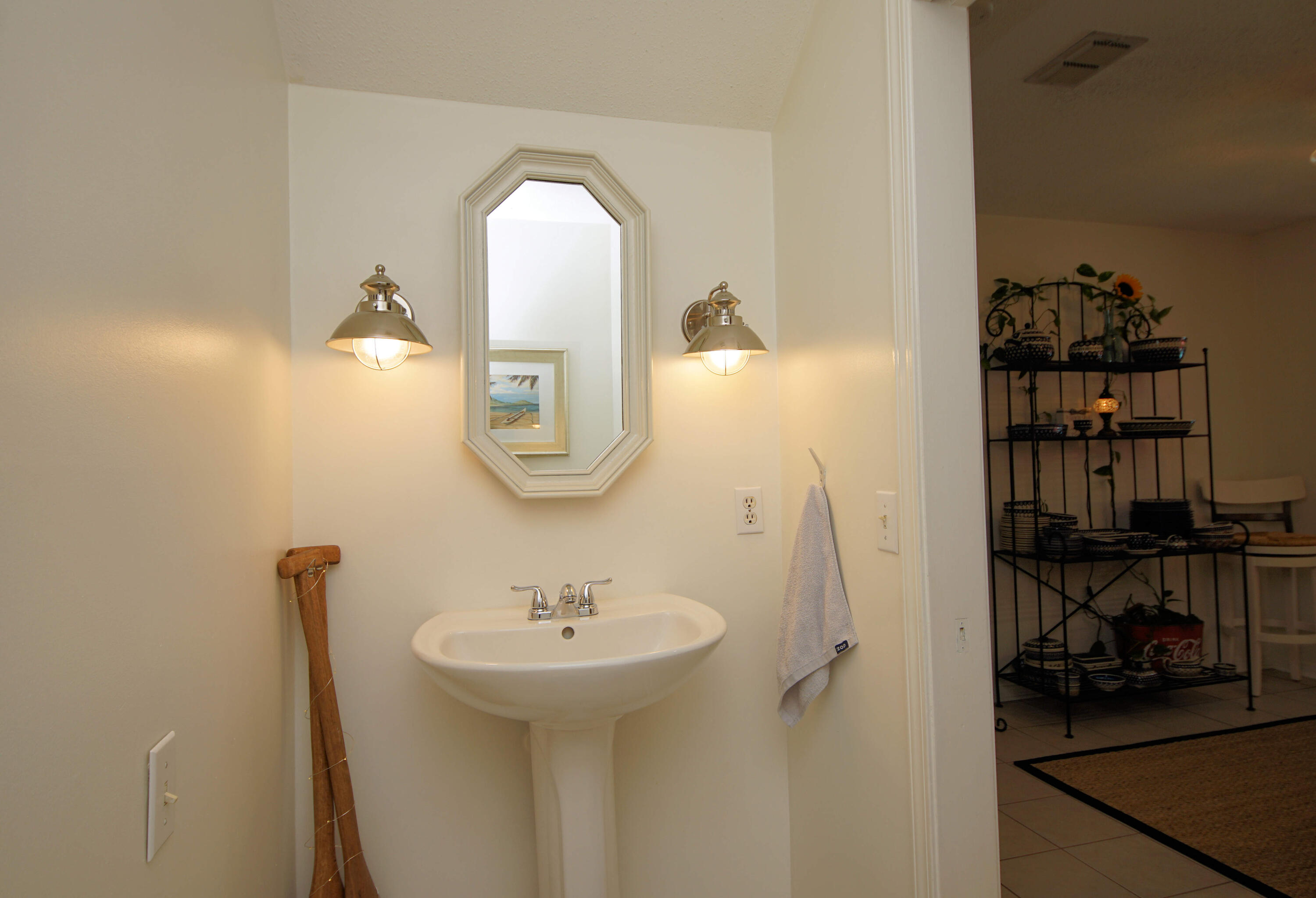 216 Country Club Road Shalimar, FL 32579 - Photo 23 of 59 a bathroom with a sink and a mirror