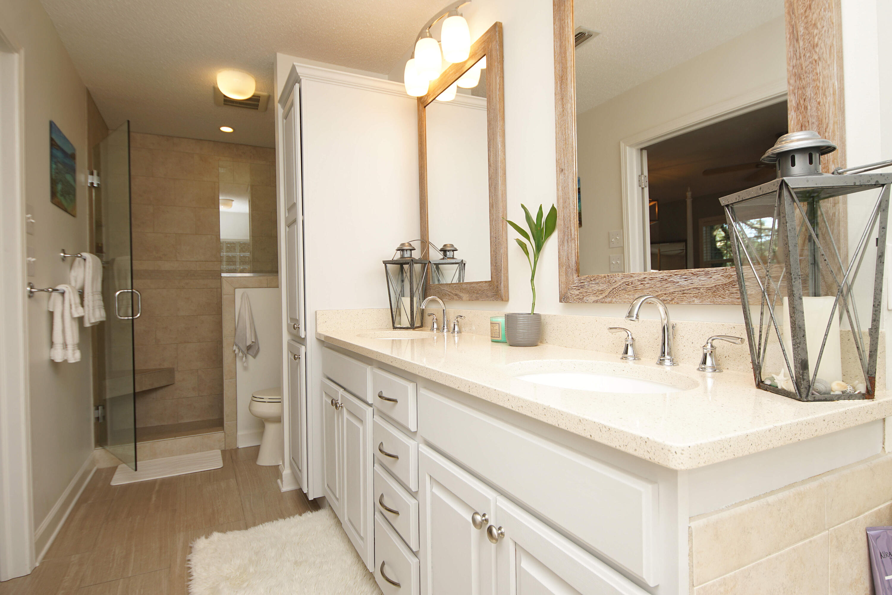 216 Country Club Road Shalimar, FL 32579 - Photo 34 of 59 a bathroom with double vanity sink a shower and a mirror