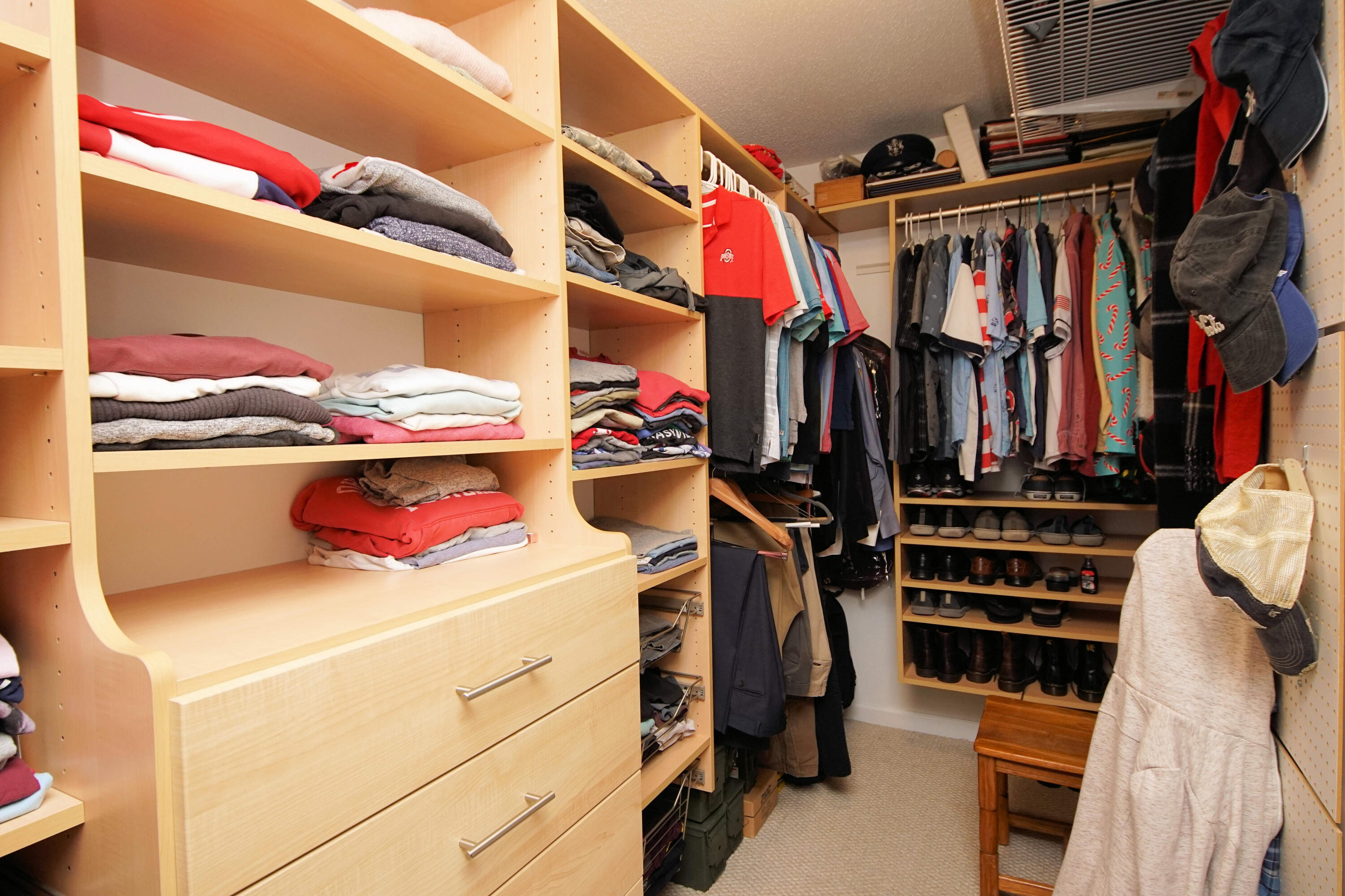 216 Country Club Road Shalimar, FL 32579 - Photo 37 of 59 a view of walk in closet with clothes and shoes