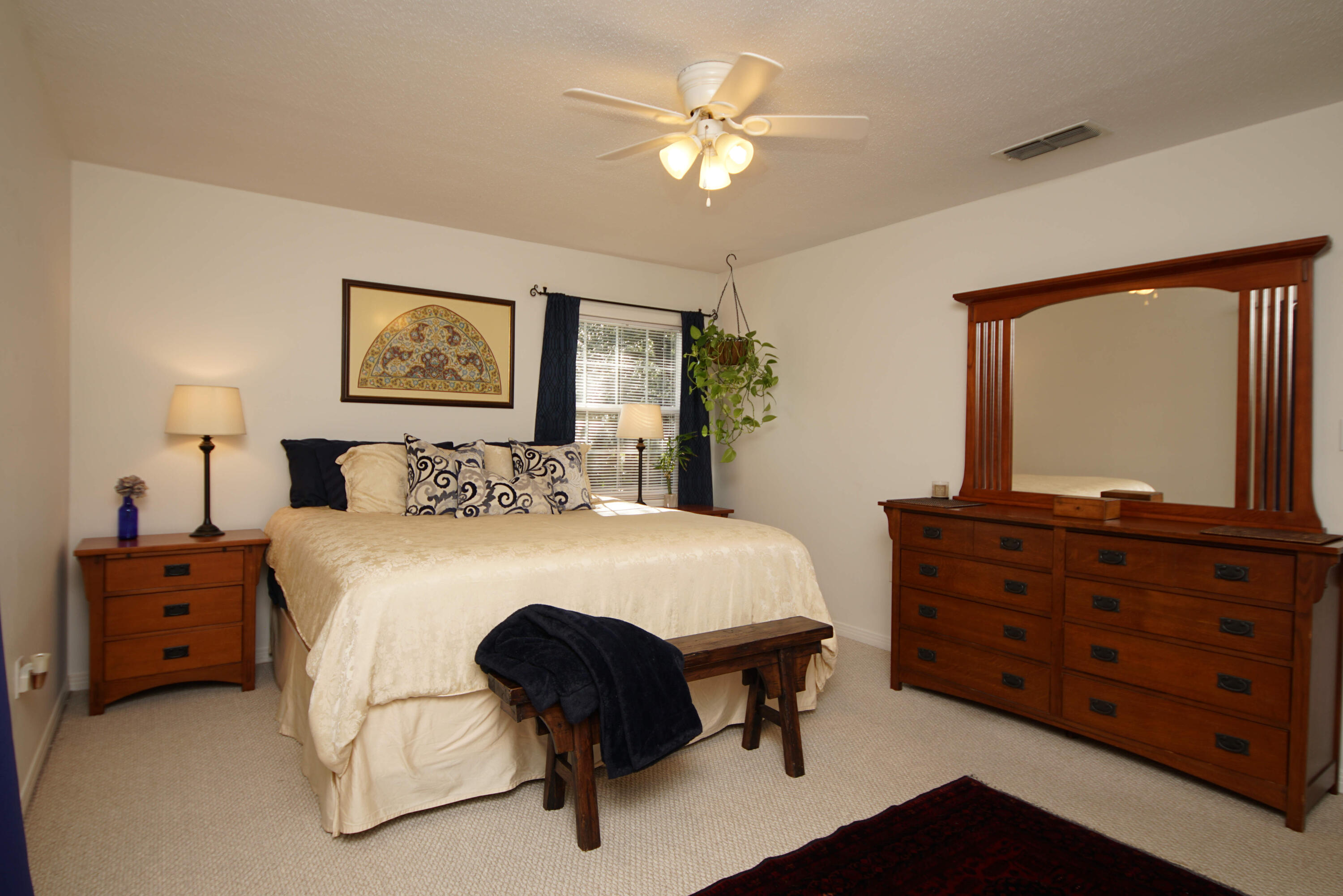 216 Country Club Road Shalimar, FL 32579 - Photo 39 of 59 a bedroom with a bed and a dresser