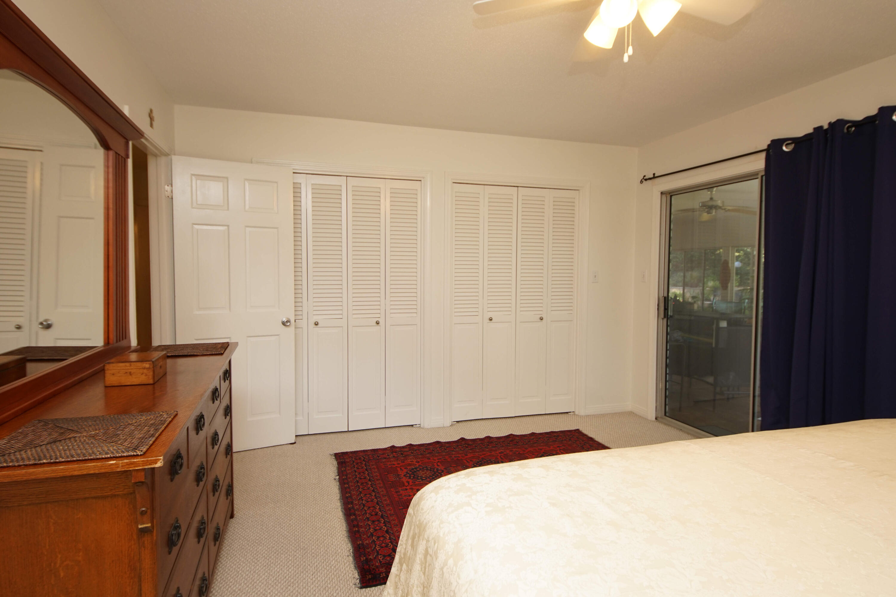 216 Country Club Road Shalimar, FL 32579 - Photo 40 of 59 a bedroom with a bed and a dresser