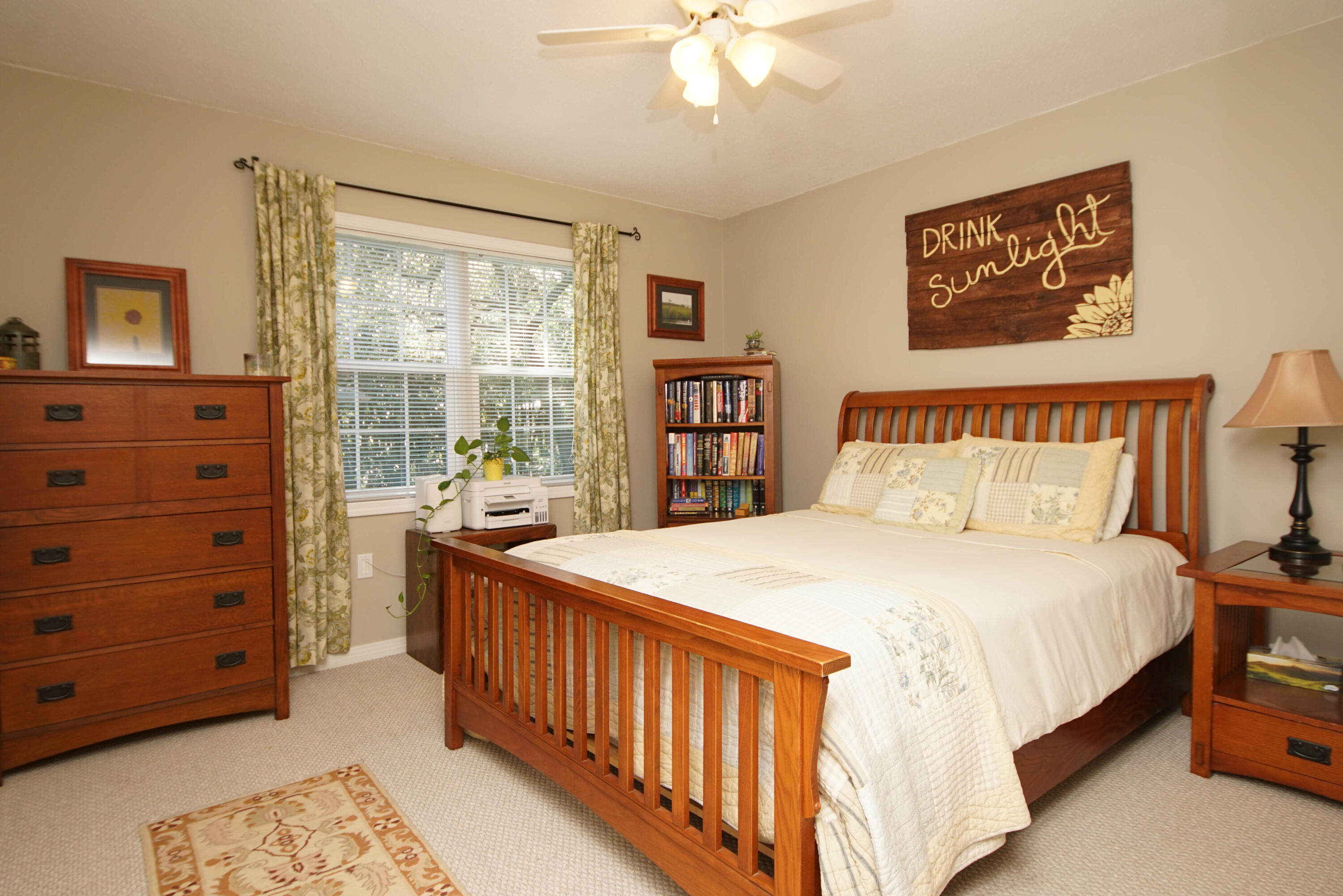 216 Country Club Road Shalimar, FL 32579 - Photo 41 of 59 a bedroom with a bed a dresser and next to a window