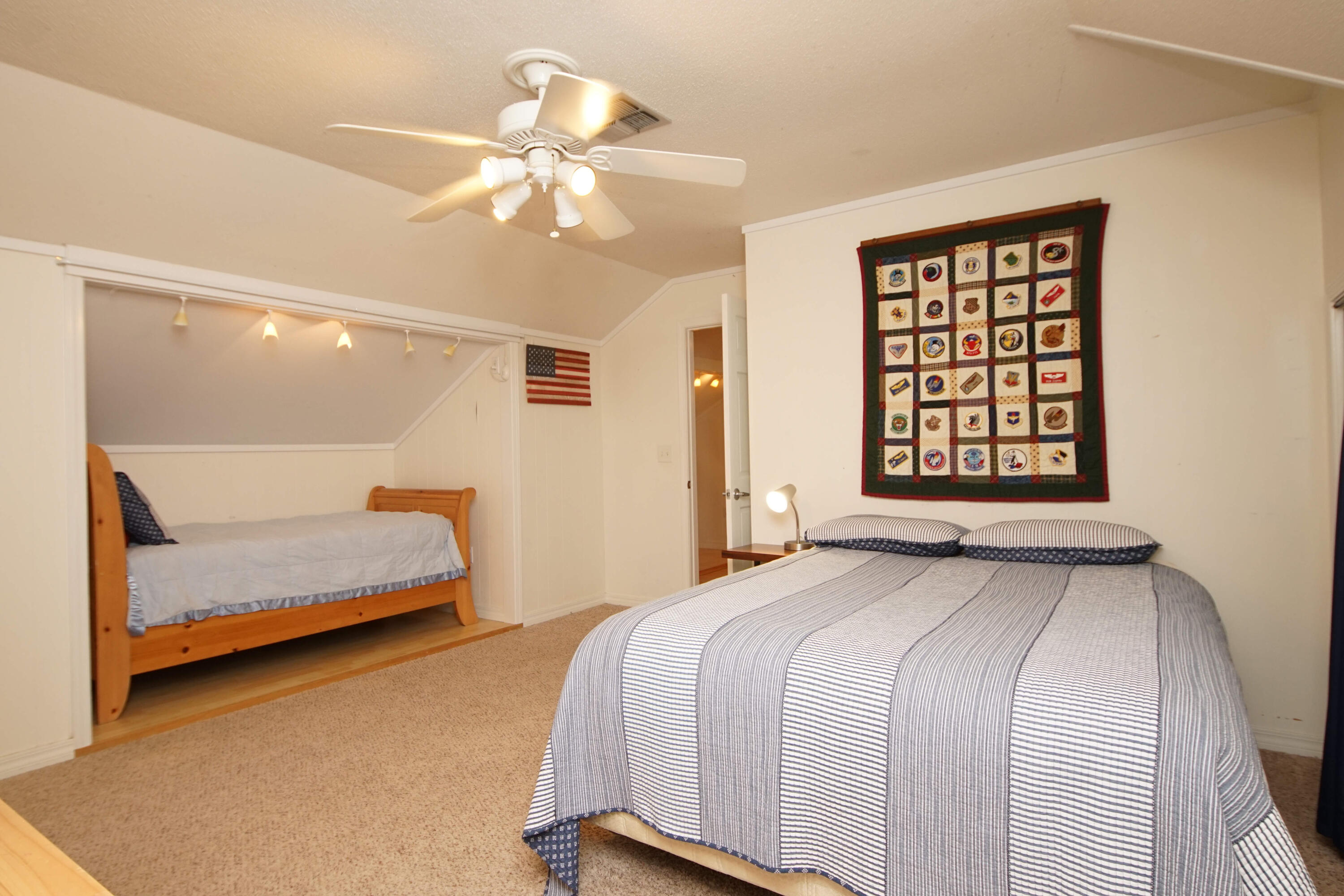 216 Country Club Road Shalimar, FL 32579 - Photo 46 of 59 a bedroom with a bed and a night stand