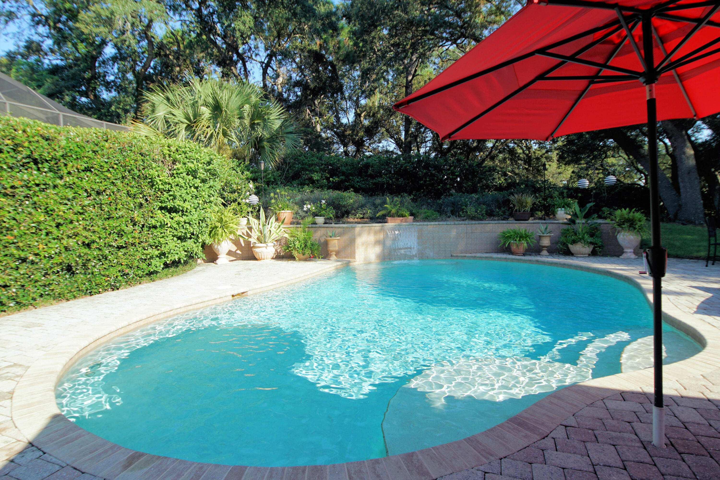 216 Country Club Road Shalimar, FL 32579 - Photo 5 of 59 a view of a swimming pool with a patio