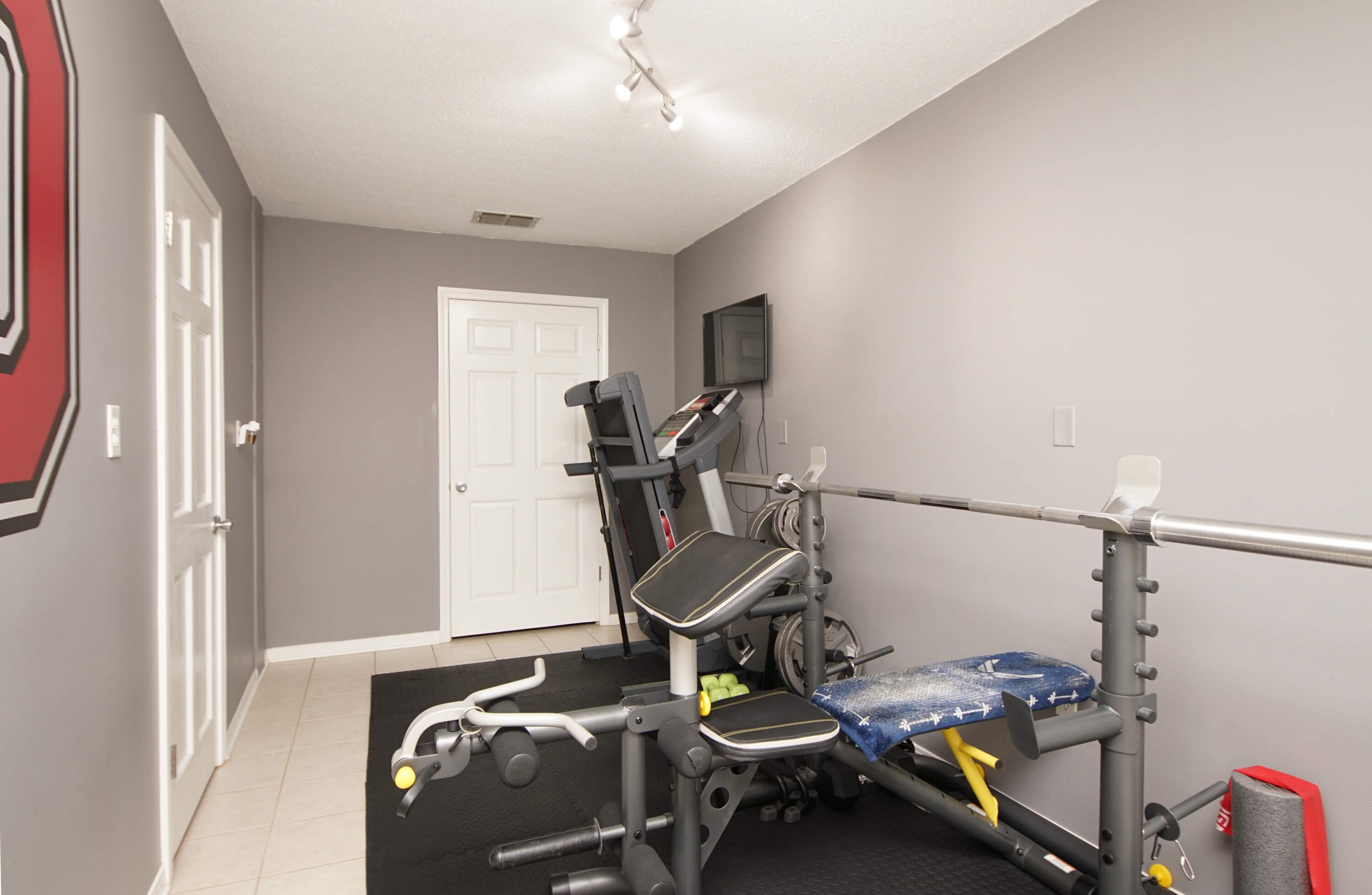 216 Country Club Road Shalimar, FL 32579 - Photo 53 of 59 a room with furniture and gym equipment