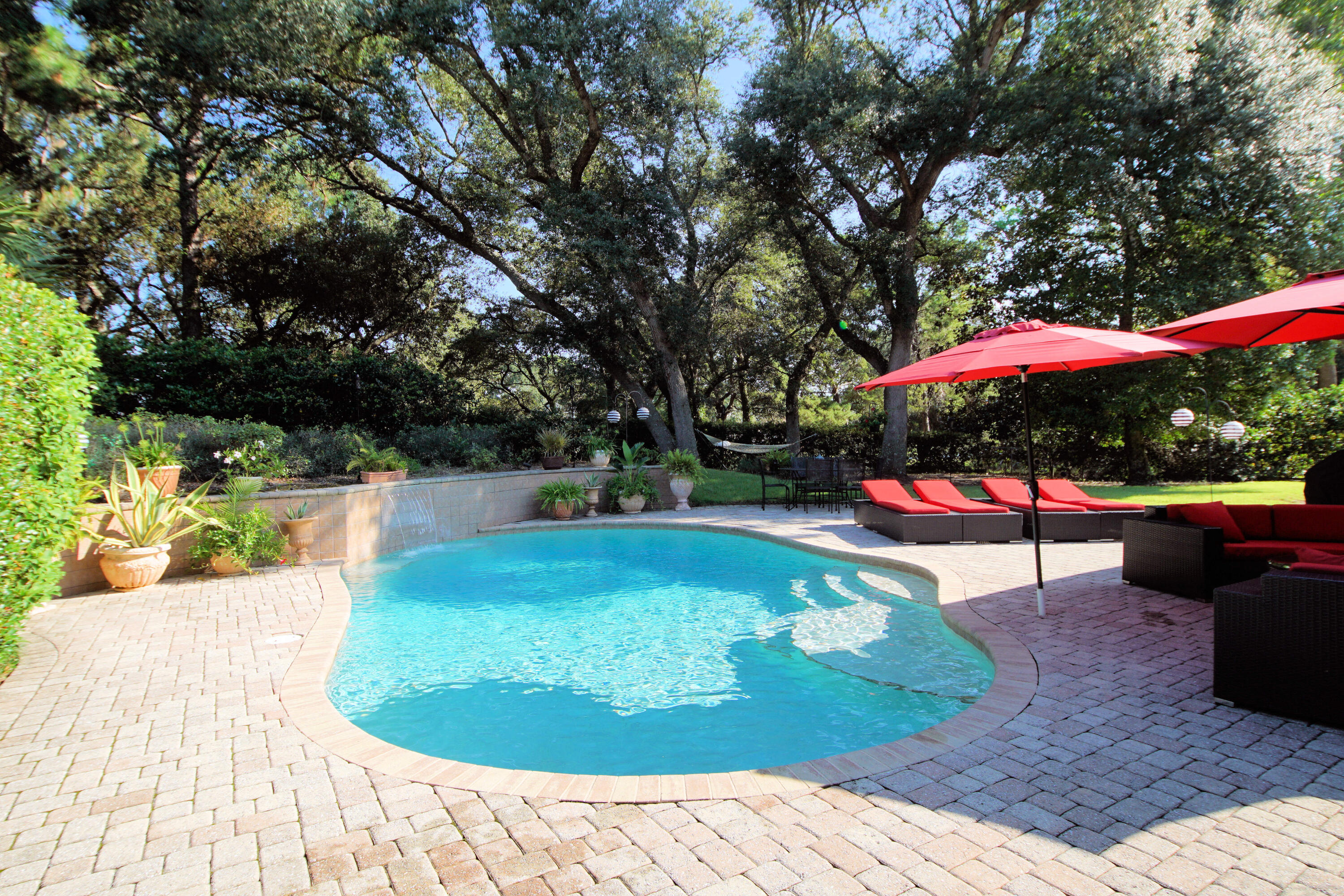 216 Country Club Road Shalimar, FL 32579 - Photo 6 of 59 a view of a swimming pool with a patio
