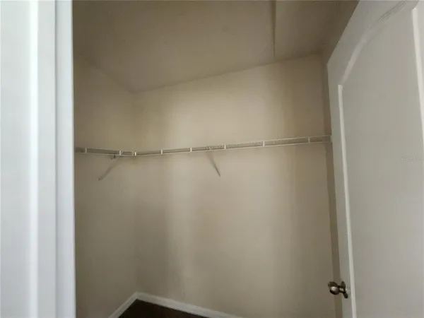 a bathroom with a white toilet and a shower